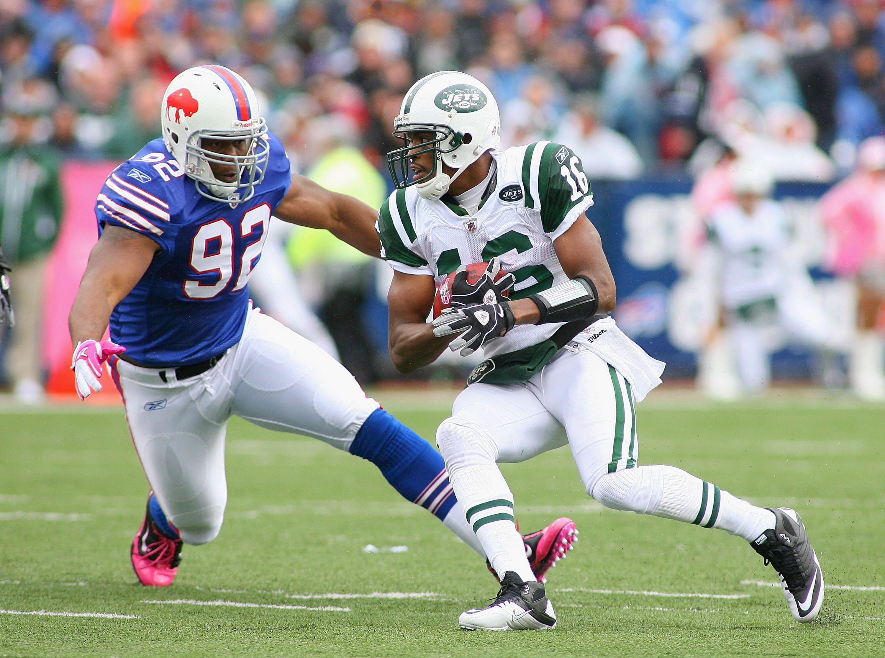 ORCHARD PARK, NY - OCTOBER 03: Brad Smith #16  of the New York Jets runs around Alex Carrington #92 of the Buffalo Bills at Ralph Wilson Stadium on October 3, 2010 in Orchard Park, New York.  (Photo by Rick Stewart/Getty Images)