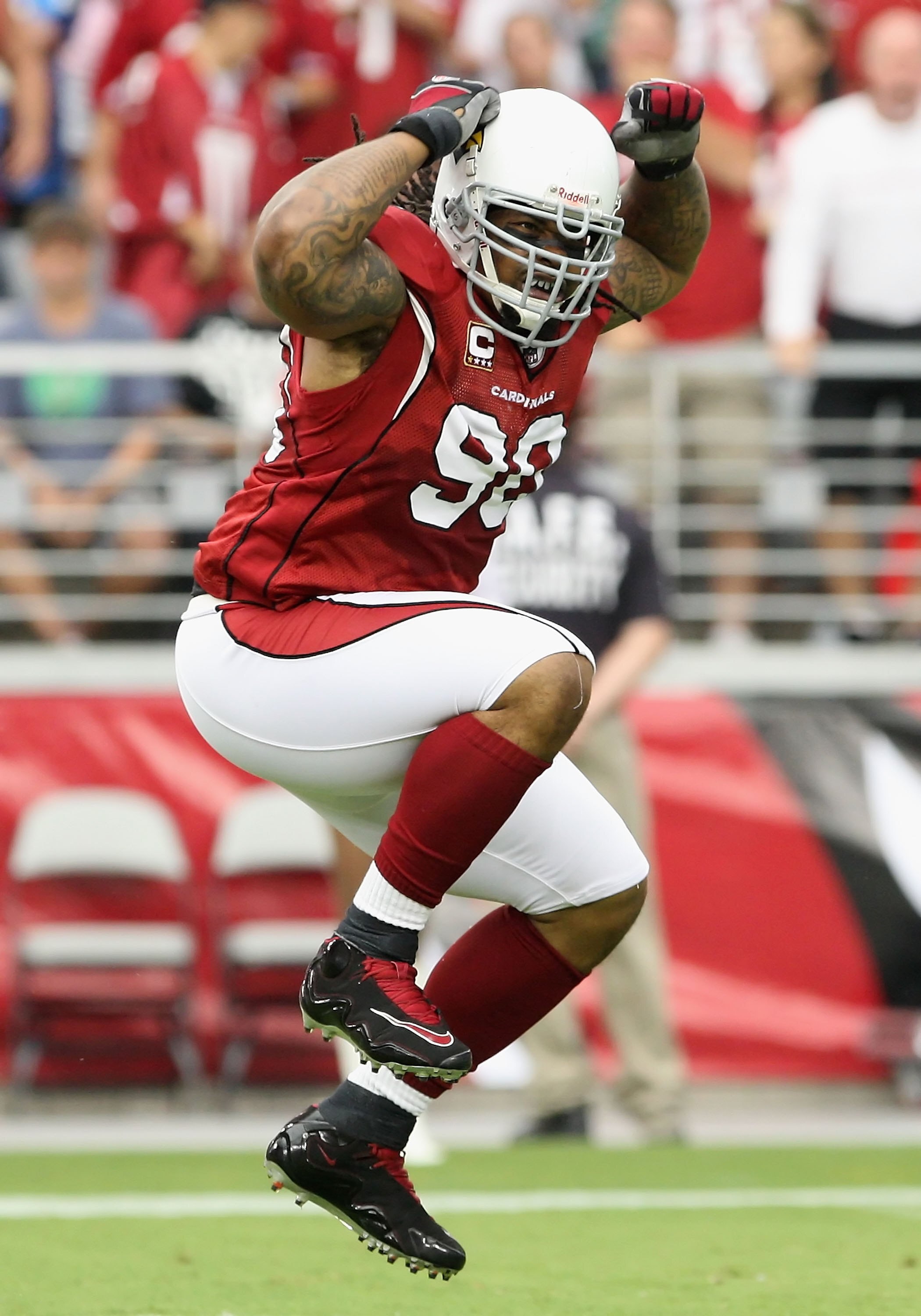 GLENDALE, AZ - SEPTEMBER 13:  Defenisve tackle Darnell Dockett #90 of the Arizona Cardinals celebrates after a sack during the NFL game against the San Francisco 49ers at the Universtity of Phoenix Stadium on September 13, 2009 in Glendale, Arizona. The 4