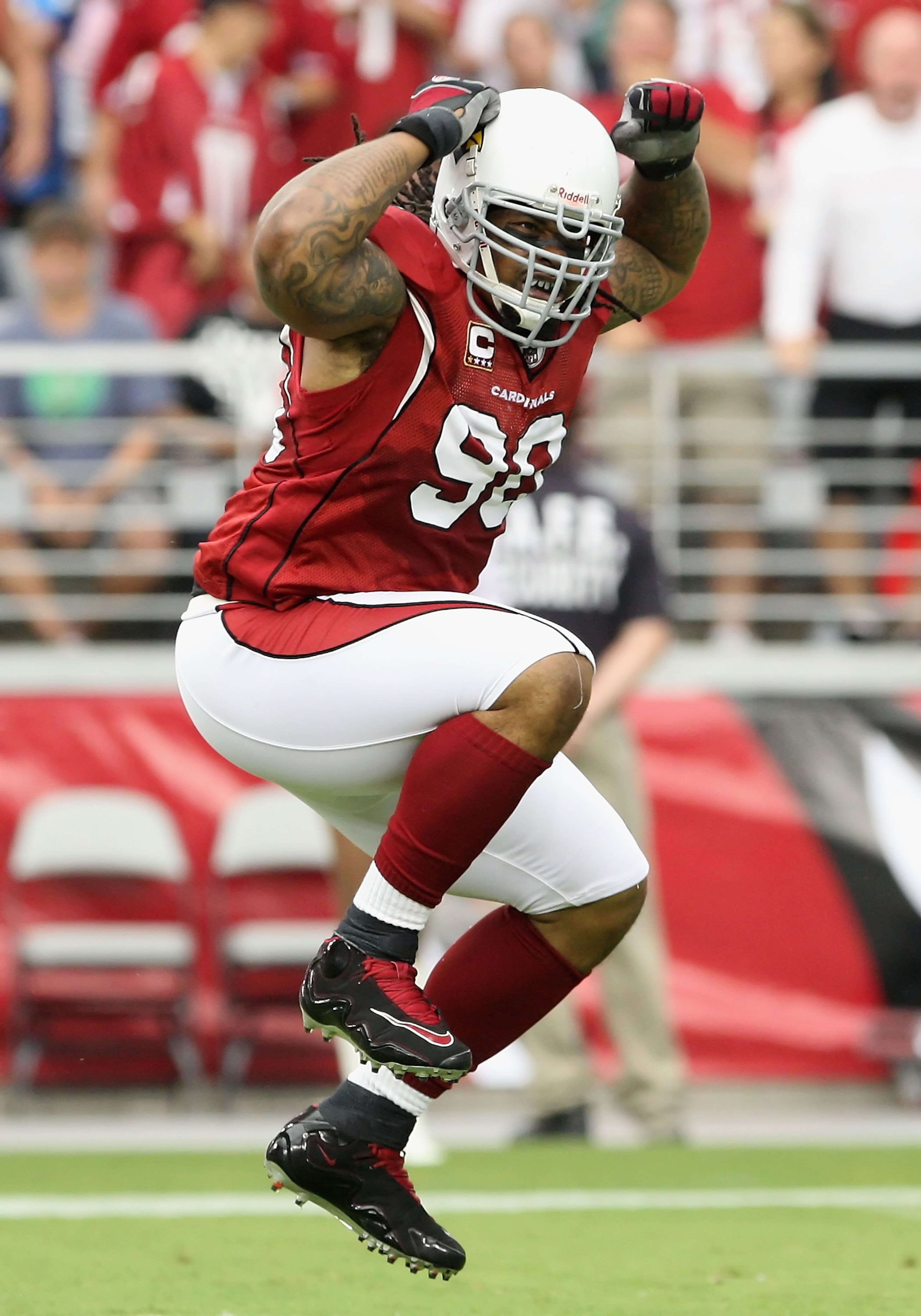 GLENDALE, AZ - SEPTEMBER 13:  Defenisve tackle Darnell Dockett #90 of the Arizona Cardinals celebrates after a sack during the NFL game against the San Francisco 49ers at the Universtity of Phoenix Stadium on September 13, 2009 in Glendale, Arizona. The 4