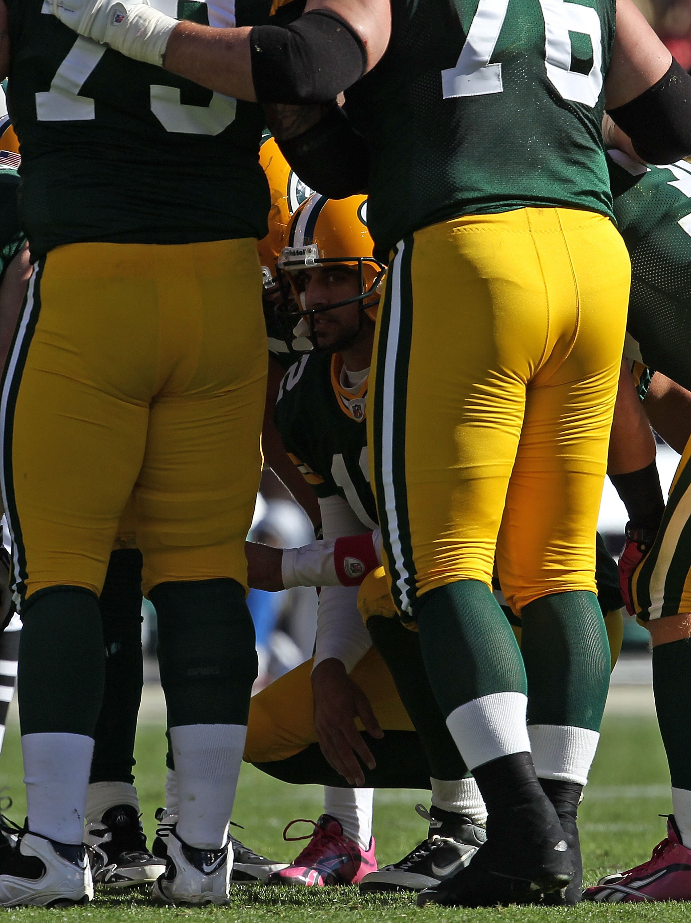 GREEN BAY, WI - OCTOBER 03: Aaron Rodgers #12 of the Green Bay Packers calls a play in the huddle against the Detroit Lions at Lambeau Field on October 3, 2010 in Green Bay, Wisconsin. The Packers defeated the Lions 28-26. (Photo by Jonathan Daniel/Getty