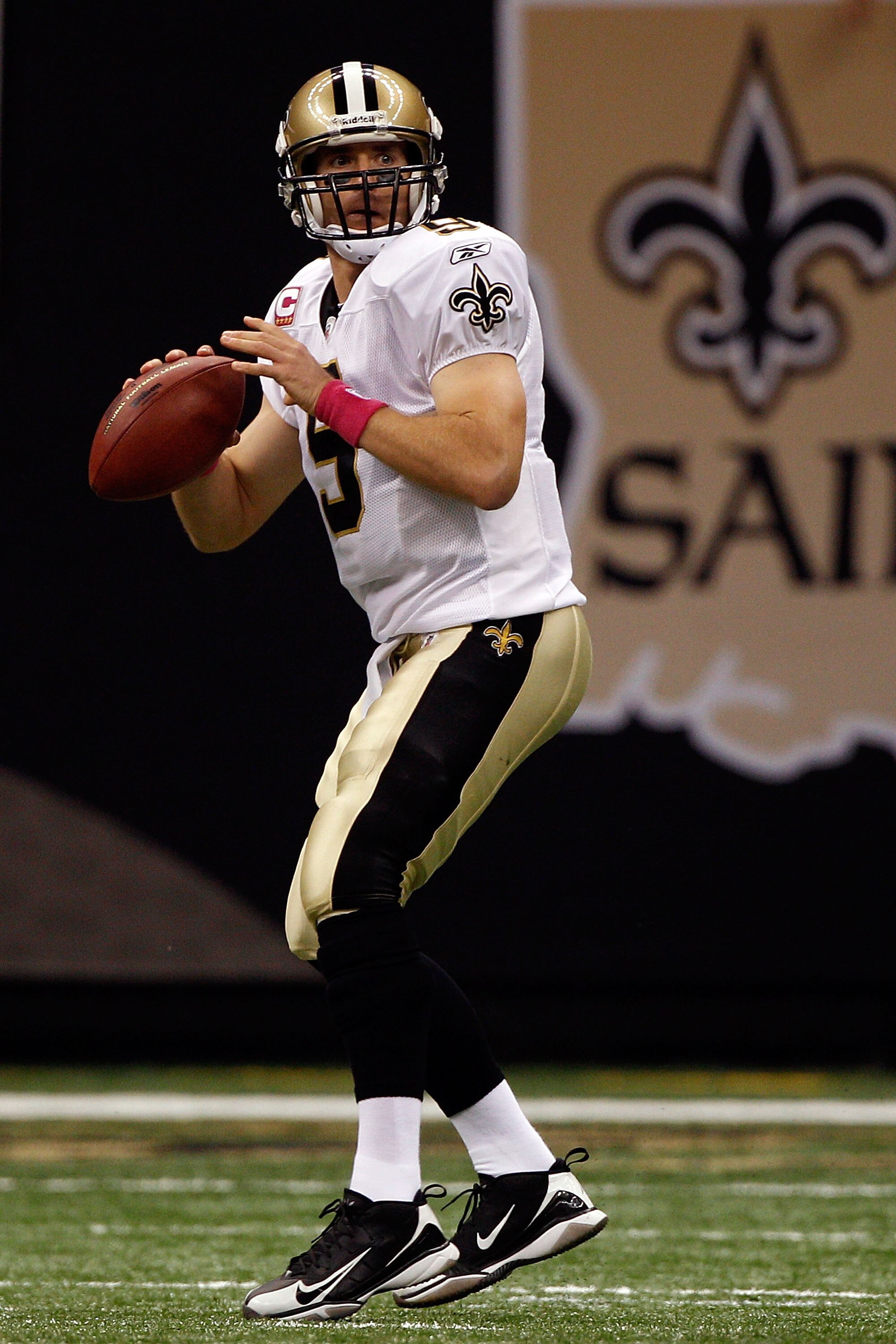NEW ORLEANS - OCTOBER 03:  Drew Brees #9 of the New Orleans Saints looks to throw a pass against the Carolina Panthers at the Louisiana Superdome on October 3, 2010 in New Orleans, Louisiana.  of the Carolina Panthers   (Photo by Chris Graythen/Getty Imag