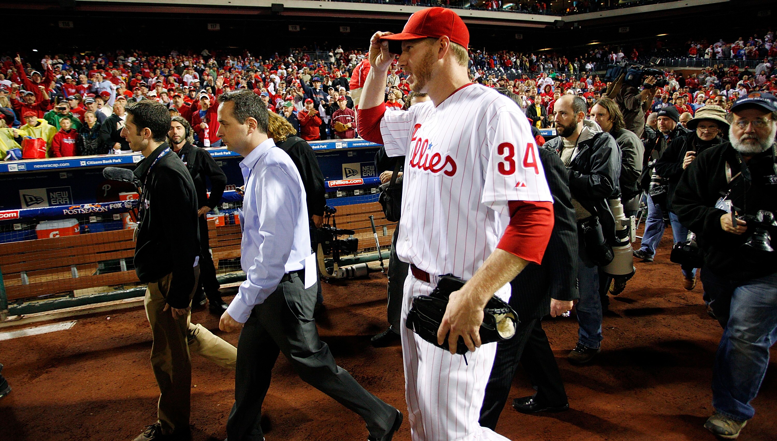 PHILADELPHIA - OCTOBER 06:  Roy Halladay #34 of the Philadelphia Phillies walks to the dugout after pitching a no-hitter in Game 1 of the NLDS against the Cincinnati Reds at Citizens Bank Park on October 6, 2010 in Philadelphia, Pennsylvania.  (Photo by J