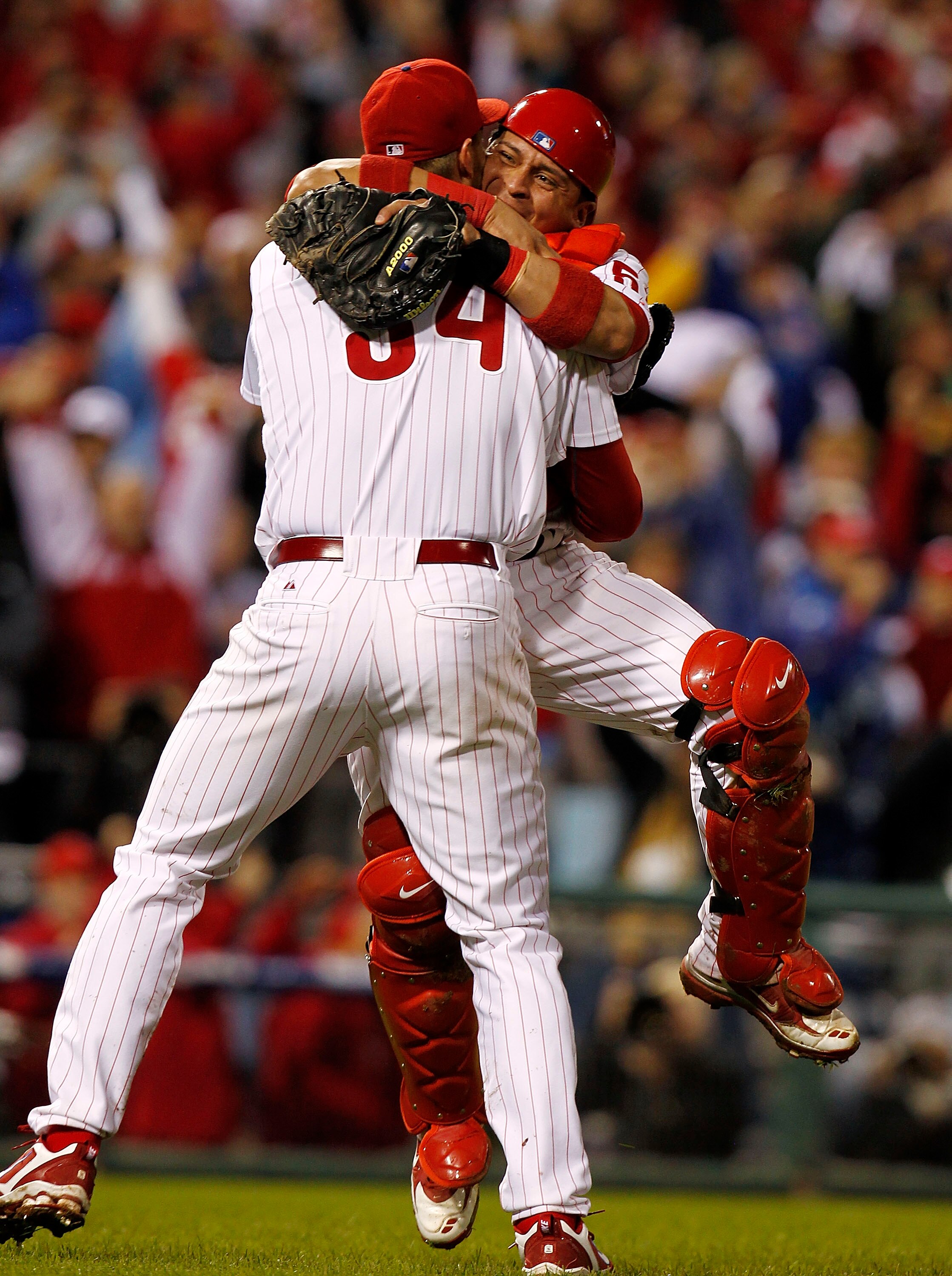 PHILADELPHIA - OCTOBER 06:  Roy Halladay #34 and Carlos Ruiz #51 of the Philadelphia Phillies celebrate Halladay's no-hitter and the win in Game 1 of the NLDS against the Cincinnati Reds at Citizens Bank Park on October 6, 2010 in Philadelphia, Pennsylvan