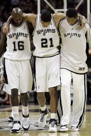 Duncan being helped off the court