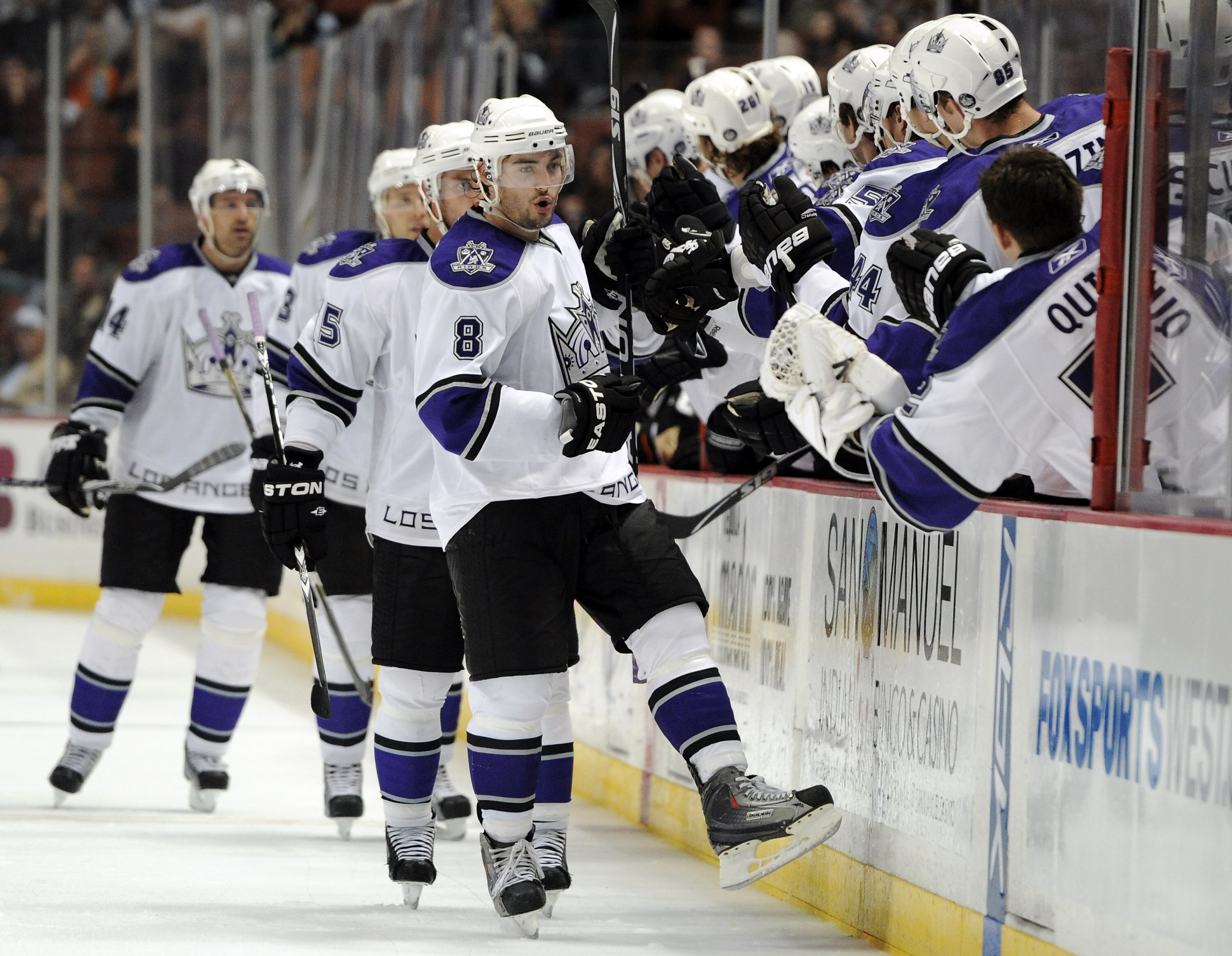 ANAHEIM, CA - OCTOBER 03:  Drew Doughty #8 of the Los Angeles Kings celebrates the goal of Jack Johnson #3 to tie the game 2-2 with his bench against the Anaheim Ducks during the third period at Honda Center on October 3, 2010 in Anaheim, California.  (Ph