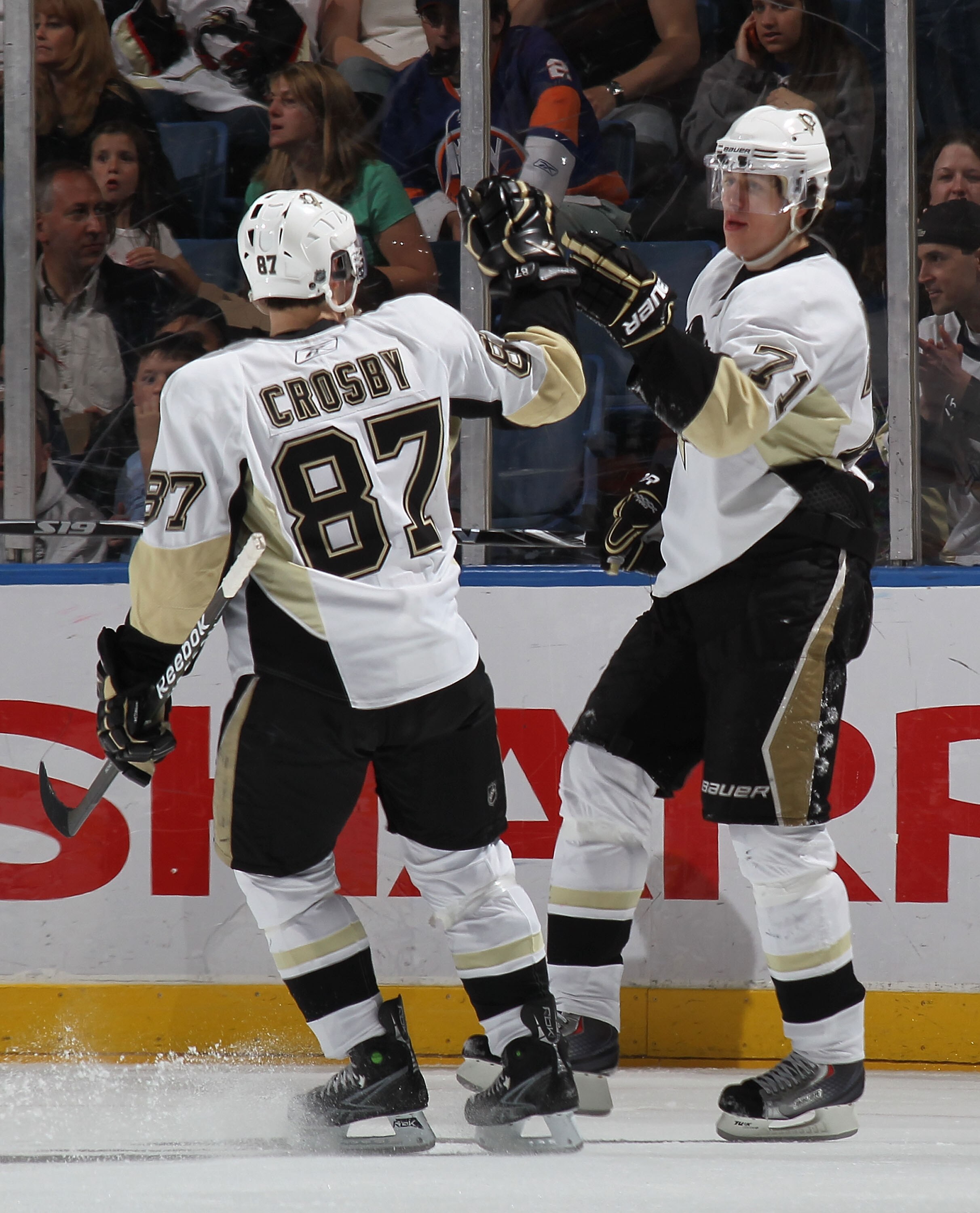 UNIONDALE, NY - APRIL 11: Sidney Crosby #87 of the Pittsburgh Penguins congratulates Evgeni Malkin #71 on his second period goal against the New York Islanders at the Nassau Coliseum on April 11, 2010 in Uniondale, New York. (Photo by Bruce Bennett/Getty