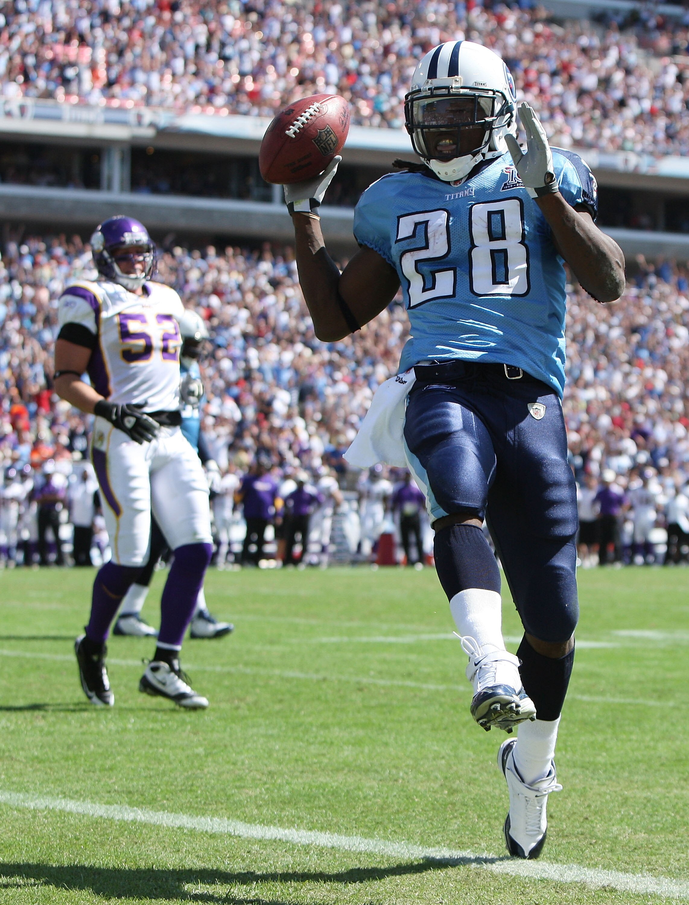 NASHVILLE, TN - SEPTEMBER 28:  Running back Chris Johnson #28 of the Tennessee Titans celebrates as he scores a touchdown past linebacker Chad Greenway #52 of the Minnesota Vikings at LP Field on September 28, 2008 in Nashville, Tennessee. The Titans defe