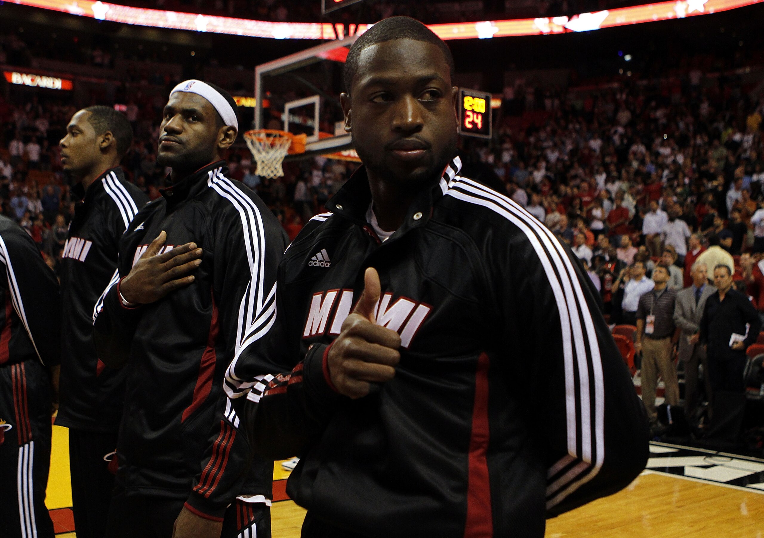 MIAMI - OCTOBER 05:  Forward LeBron James #6 (C) and teammate Dwyane Wade #3 (R) on the court before taking on the Detroit Pistons on October 5, 2010 in Miami, Florida.  NOTE TO USER: User expressly acknowledges and agrees that, by downloading and or usin