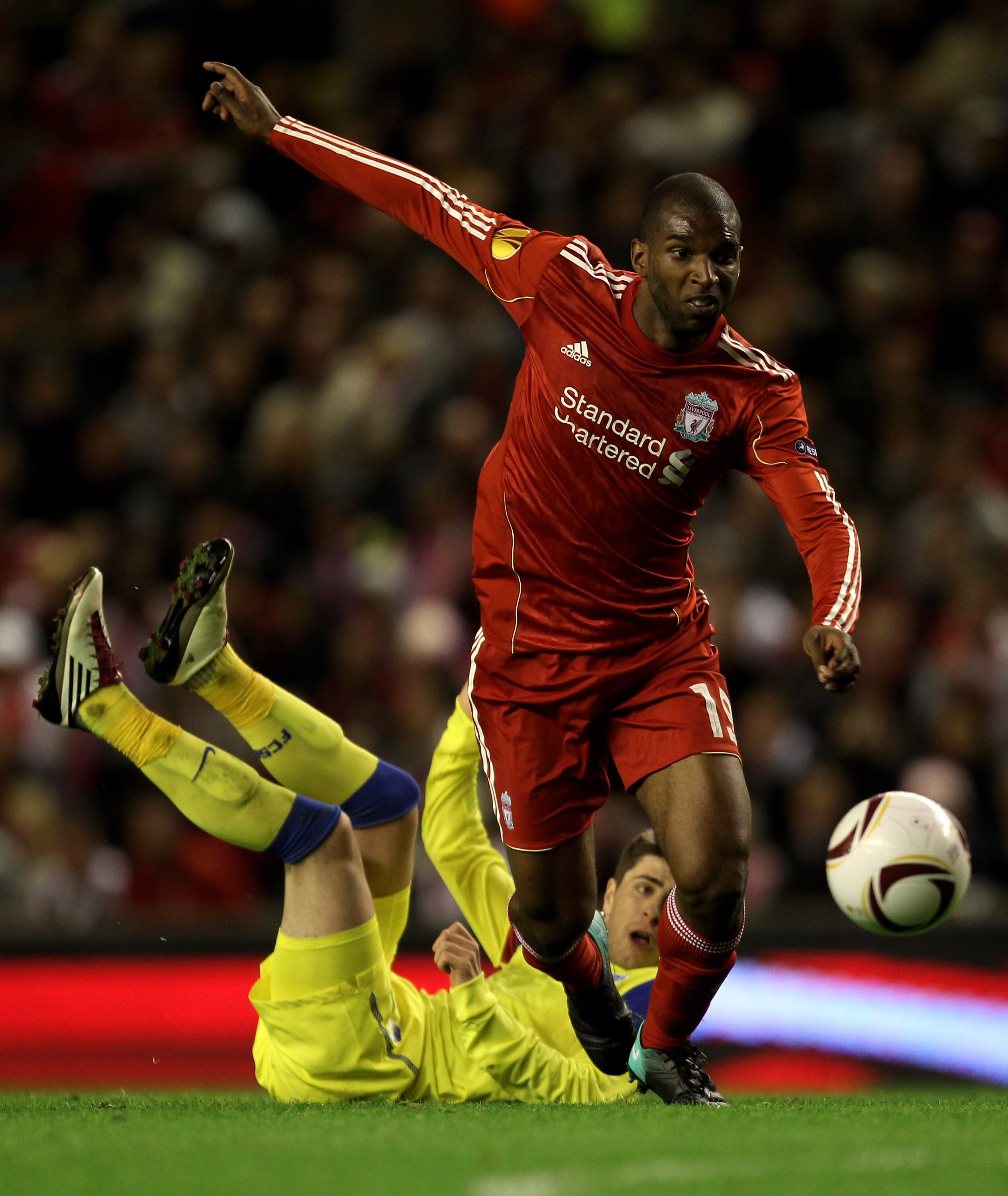 LIVERPOOL, ENGLAND - SEPTEMBER 16 : Ryan Babel of Liverpool goes past Mihai Radut of Steaua Bucharest during the UEFA Europa League Group K match beteween Liverpool and Steaua Bucharest at Anfield on September 16, 2010 in Liverpool, England. (Photo by A LIVERPOOL, ENGLAND - SEPTEMBER 16 : Ryan Babel of Liverpool goes past Mihai Radut of Steaua Bucharest during the UEFA Europa League Group K match beteween Liverpool and Steaua Bucharest at Anfield on September 16, 2010 in Liverpool, England. (Photo by A