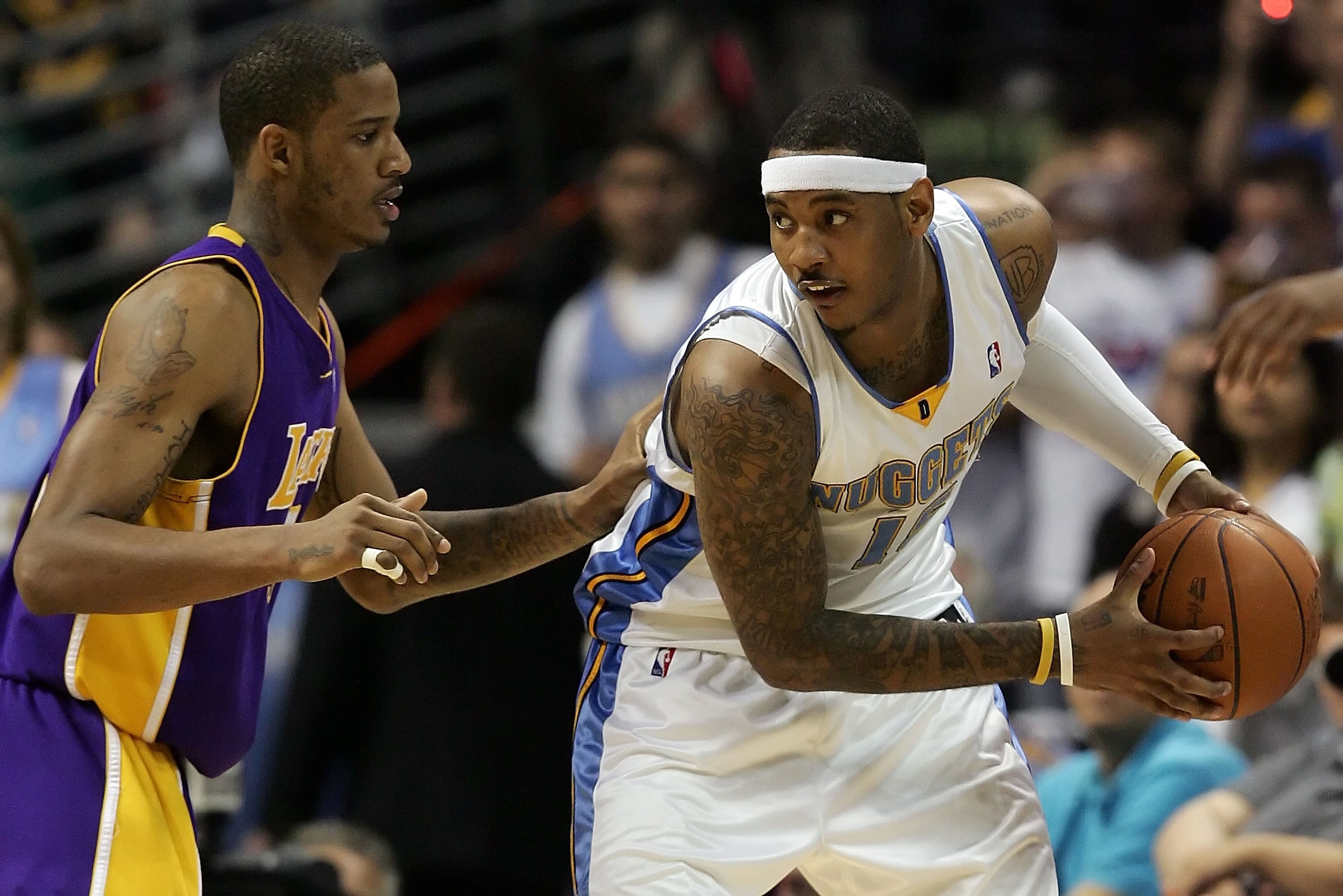 DENVER - MAY 23:  Carmelo Anthony #15 of the Denver Nuggets posts up Trevor Ariza #3 of the Los Angeles Lakers in Game Three of the Western Conference Finals during the 2009 NBA Playoffs at Pepsi Center on May 23, 2009 in Denver, Colorado. NOTE TO USER: U