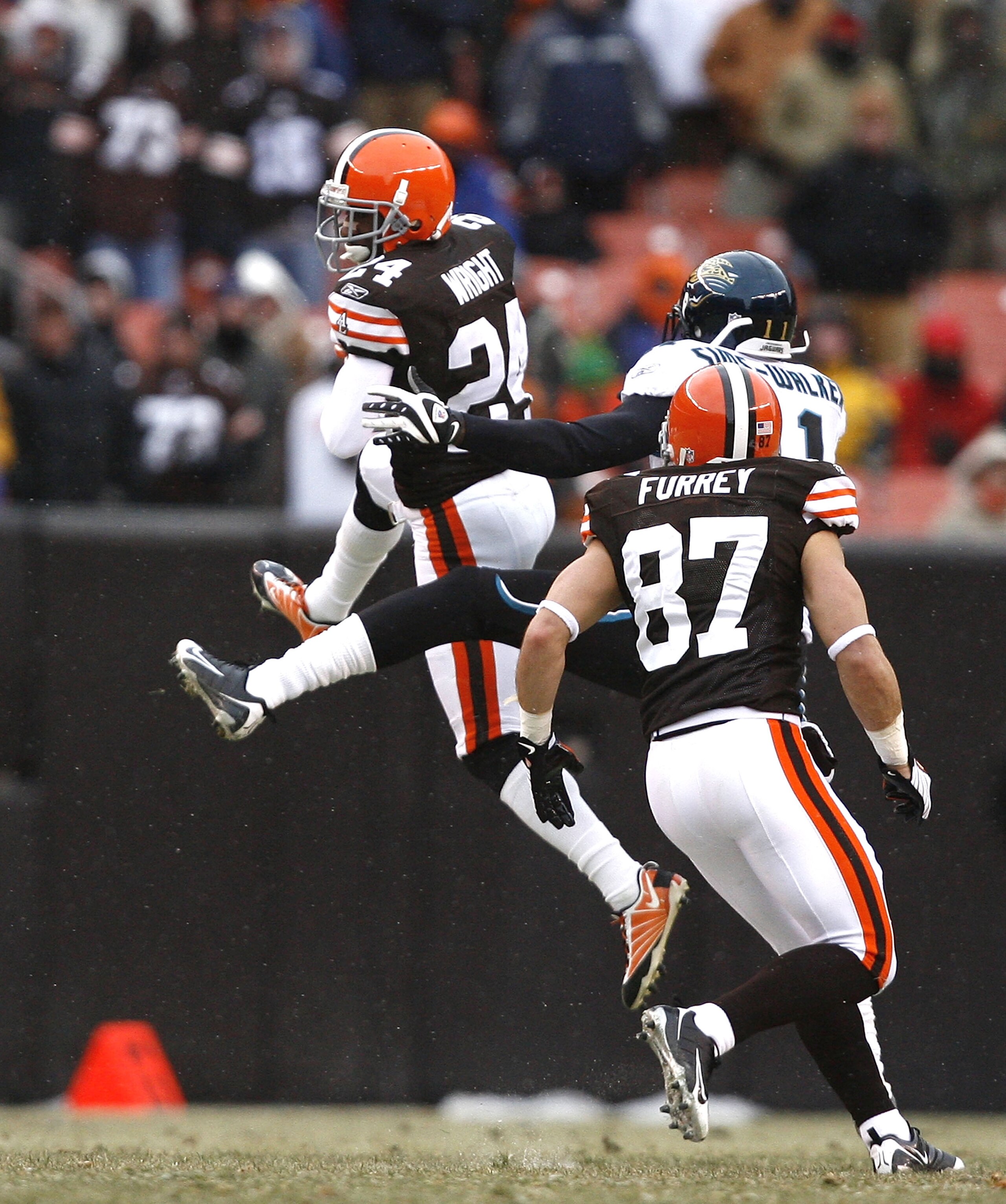 CLEVELAND - JANUARY 03: Eric Wright #24 of the Cleveland Browns interceptions the ball in front of teammates Mike Furrey #87 and Mike Sims-Walker #11 of the Jacksonville Jaguars at Cleveland Browns Stadium on January 3, 2010 in Cleveland, Ohio. (Photo b CLEVELAND - JANUARY 03: Eric Wright #24 of the Cleveland Browns interceptions the ball in front of teammates Mike Furrey #87 and Mike Sims-Walker #11 of the Jacksonville Jaguars at Cleveland Browns Stadium on January 3, 2010 in Cleveland, Ohio. (Photo b