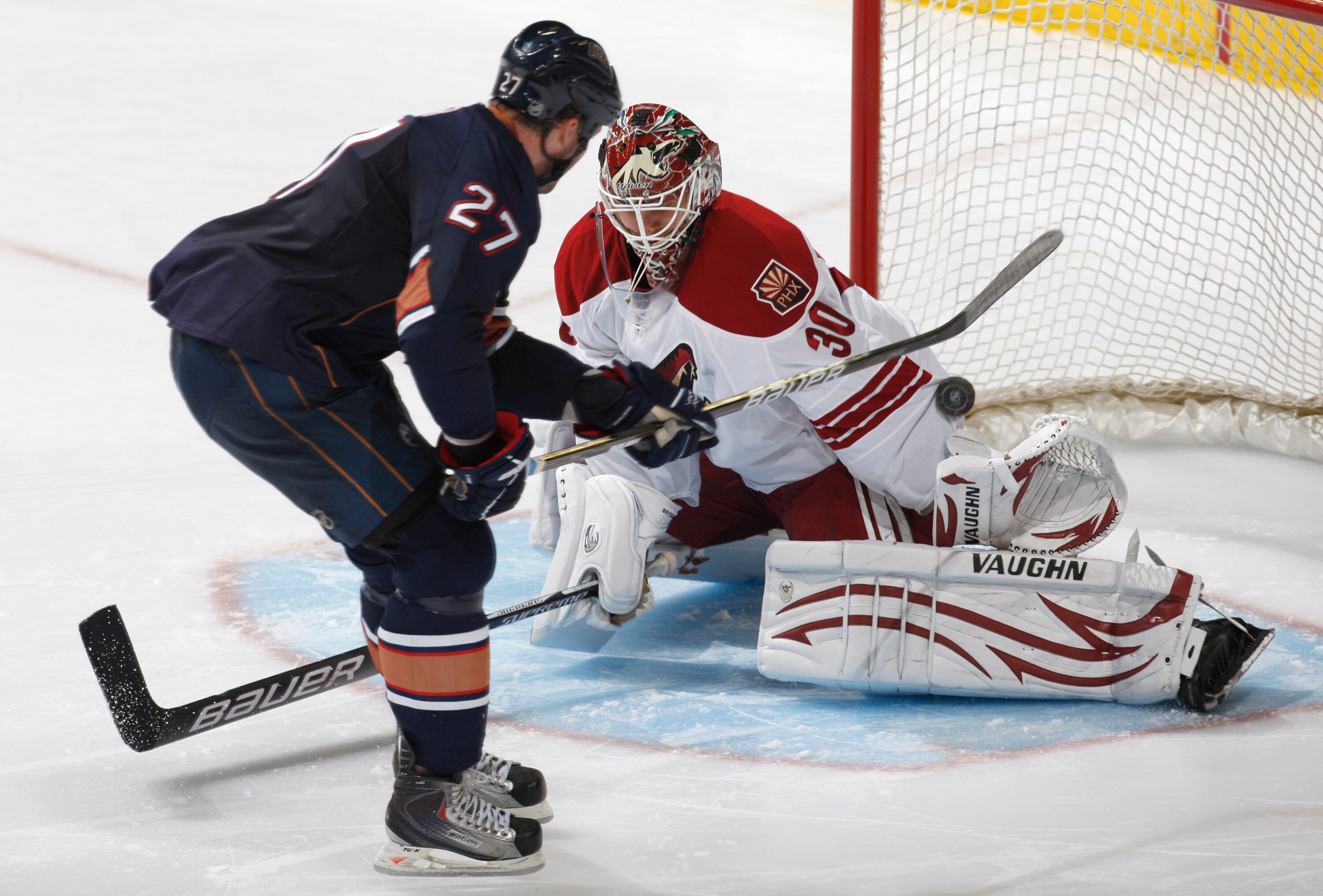 ALBERTA, CANADA - SEPTEMBER 29: Dustin Penner #27 of the Edmonton Oilers scores in a shootout on Ilya Bryzgalov #30 of the Phoenix Coyotes to win the game 4-3 on September 29, 2010 at Rexall Place in Edmonton, Alberta, Canada. (Photo by Dale MacMillan/Get