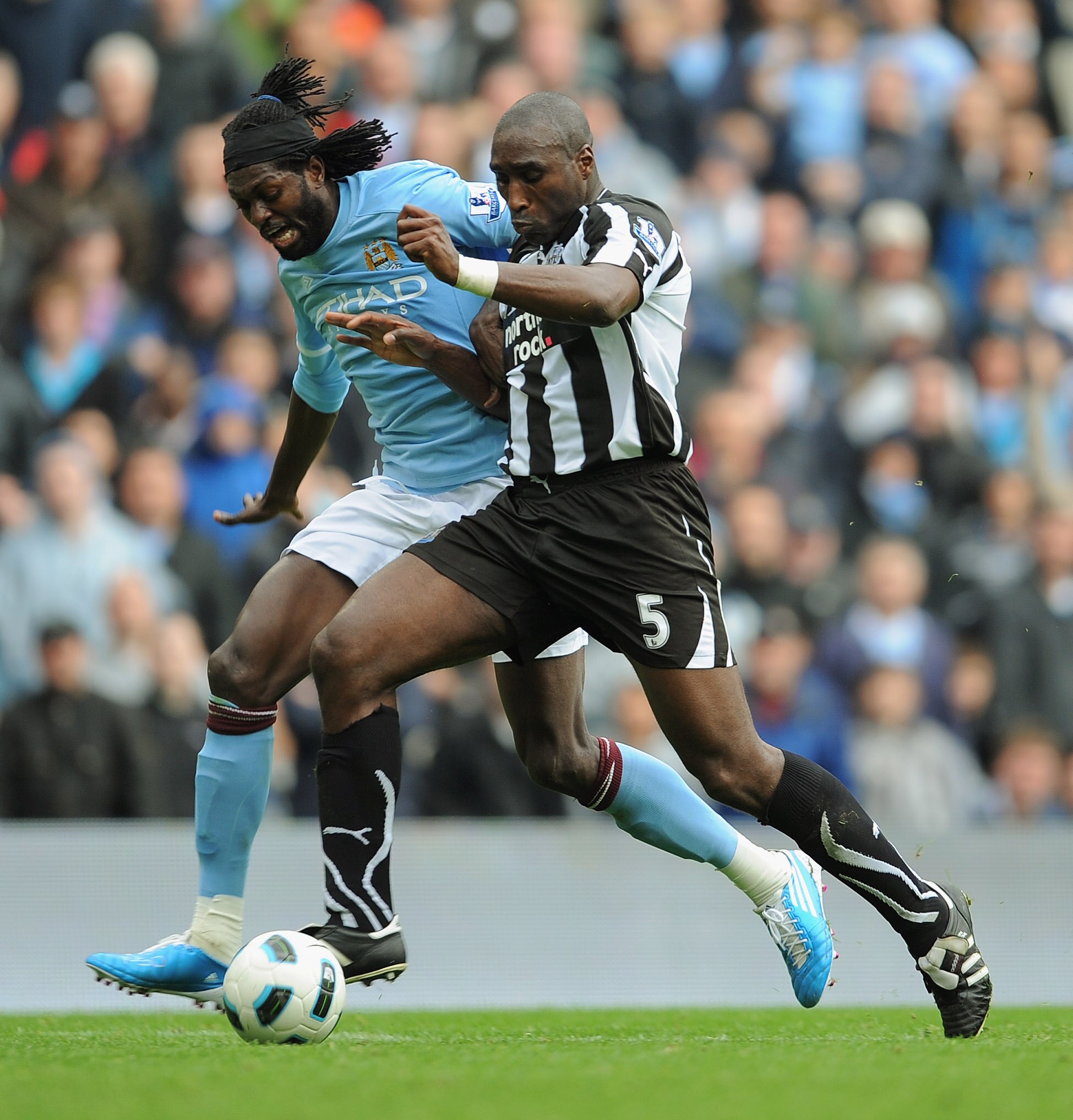 MANCHESTER, ENGLAND - OCTOBER 03: Emmanuel Adebayor of Manchester City in action with Sol Campbell of Newcastle during the Barclays Premier League match between Manchester City and Newcastle United at the City of Manchester Stadium on October 3, 2010 in MANCHESTER, ENGLAND - OCTOBER 03: Emmanuel Adebayor of Manchester City in action with Sol Campbell of Newcastle during the Barclays Premier League match between Manchester City and Newcastle United at the City of Manchester Stadium on October 3, 2010 in
