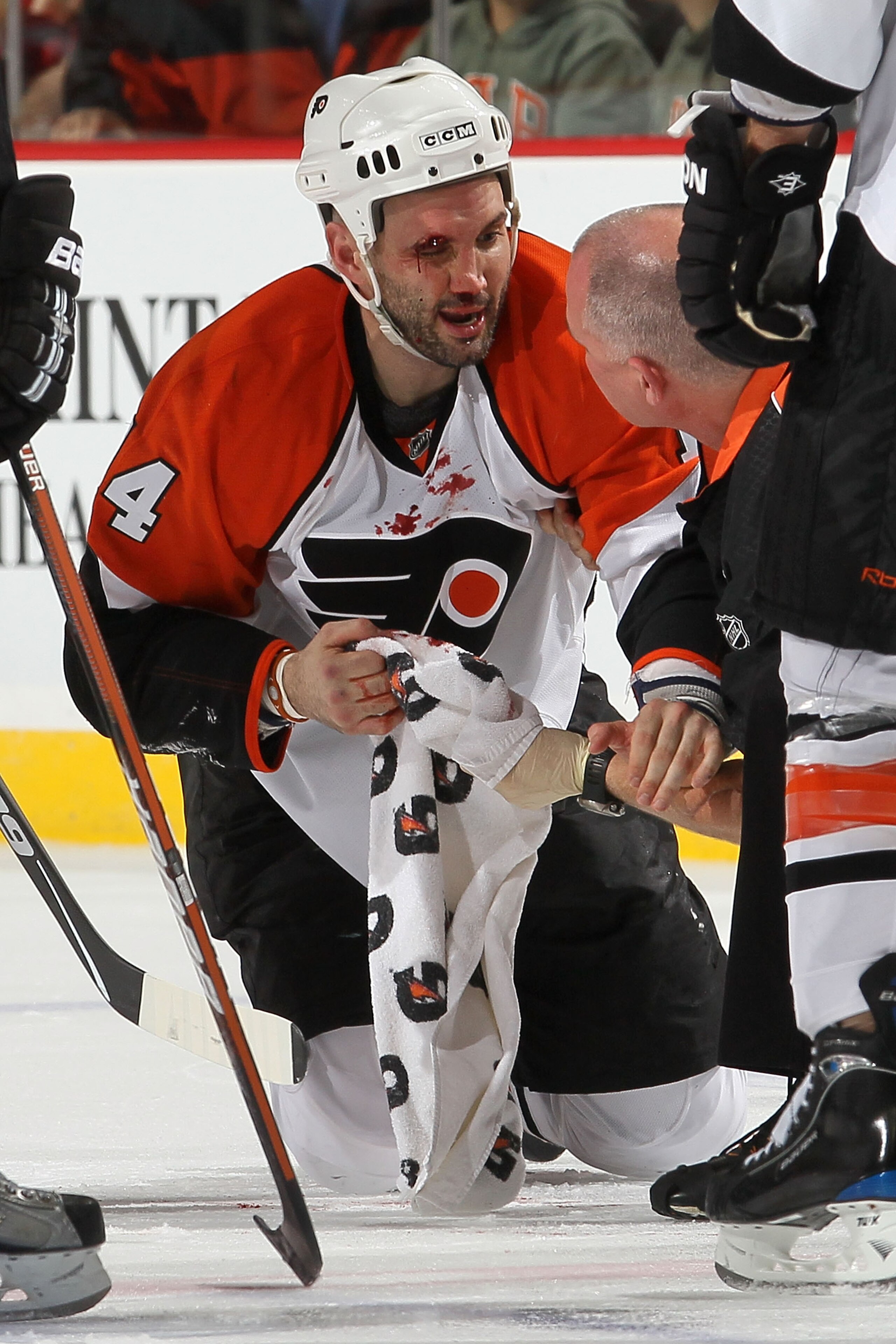 NEWARK, NJ - APRIL 22: Ian Laperriere #14 of the Philadelphia Flyers reacts after being injured in the second period by Colin White #5 of the New Jersey Devils in Game 5 of the Eastern Conference Quarterfinals during the 2010 NHL Stanley Cup Playoffs at NEWARK, NJ - APRIL 22: Ian Laperriere #14 of the Philadelphia Flyers reacts after being injured in the second period by Colin White #5 of the New Jersey Devils in Game 5 of the Eastern Conference Quarterfinals during the 2010 NHL Stanley Cup Playoffs at