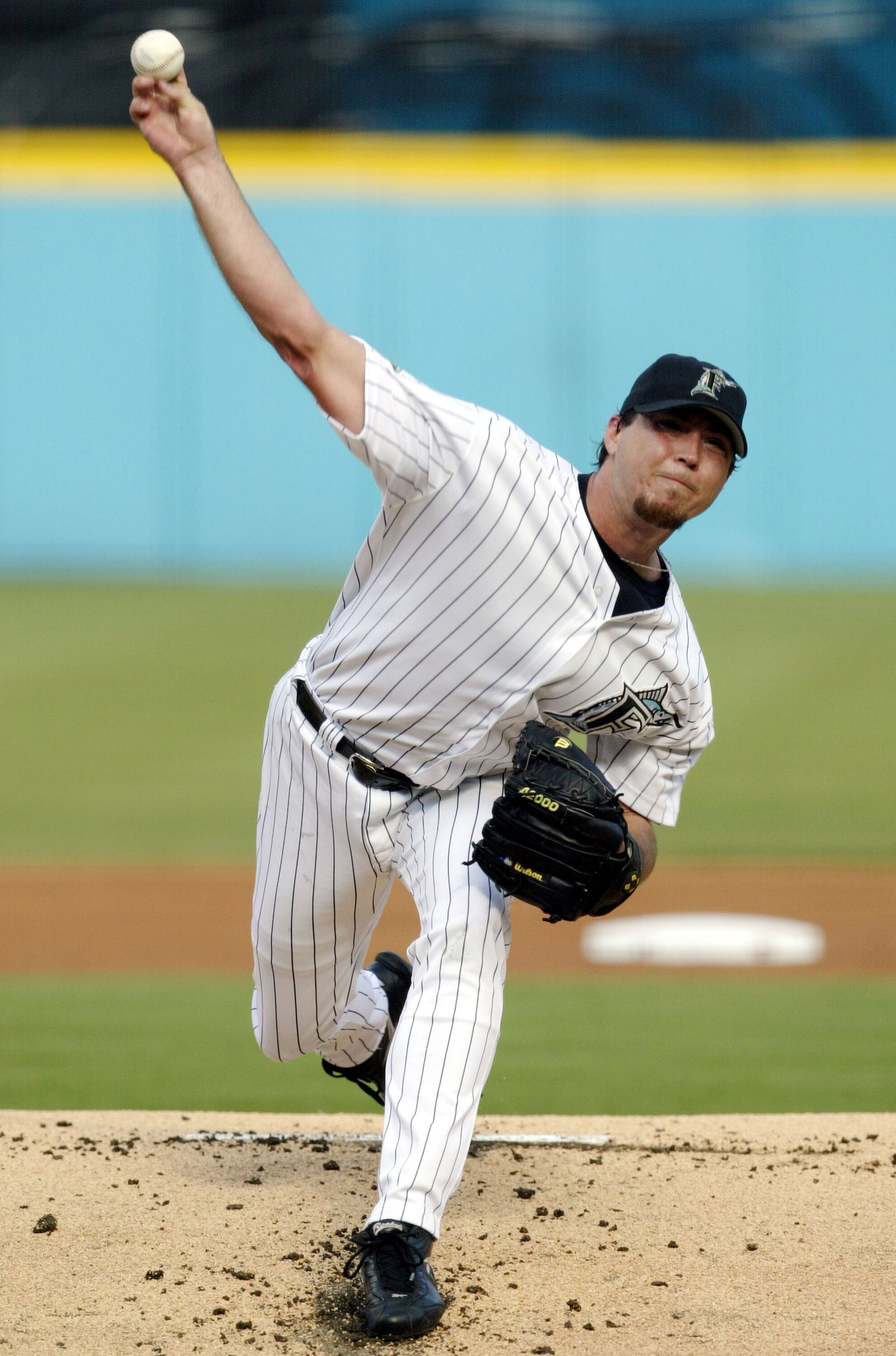 MIAMI - OCTOBER 12:  Starting pitcher Josh Beckett #21 of the Florida Marlins pitches against the Chicago Cubs in game five of the National League Championship Series on October 12, 2003 at Pro Player Stadium in Miami, Florida.  (Photo by Brian Bahr/Getty