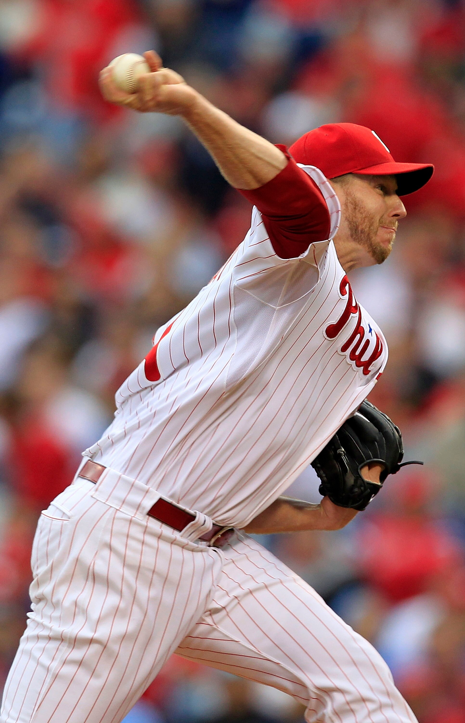 PHILADELPHIA - OCTOBER 06:  Roy Halladay #34 of the Philadelphia Phillies delivers in Game 1 of the NLDS against the Cincinnati Reds at Citizens Bank Park on October 6, 2010 in Philadelphia, Pennsylvania.  (Photo by Chris Trotman/Getty Images)