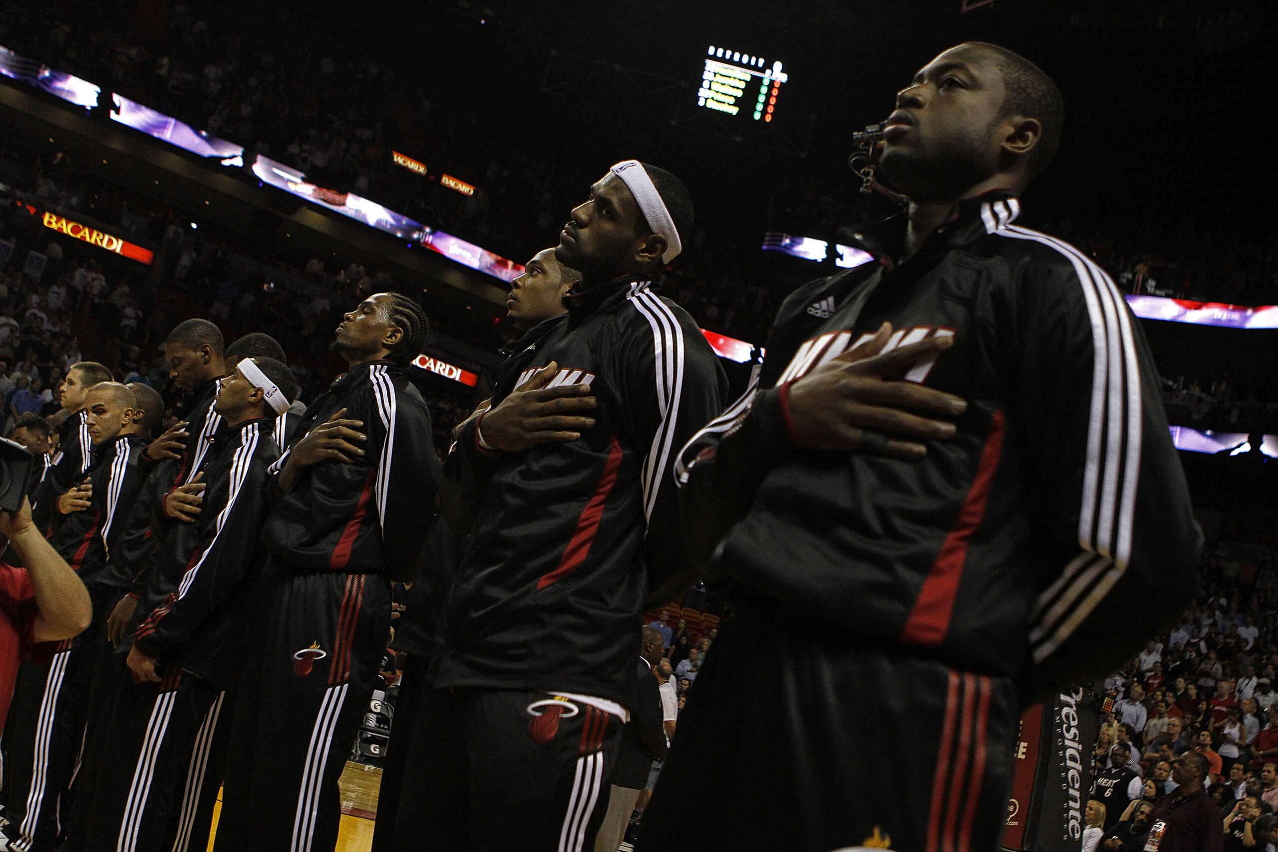 MIAMI - OCTOBER 05:  Forward LeBron James #6 (C) and teammate Dwyane Wade #3 (R) on the court before taking on the Detroit Pistons on October 5, 2010 in Miami, Florida.  NOTE TO USER: User expressly acknowledges and agrees that, by downloading and or usin