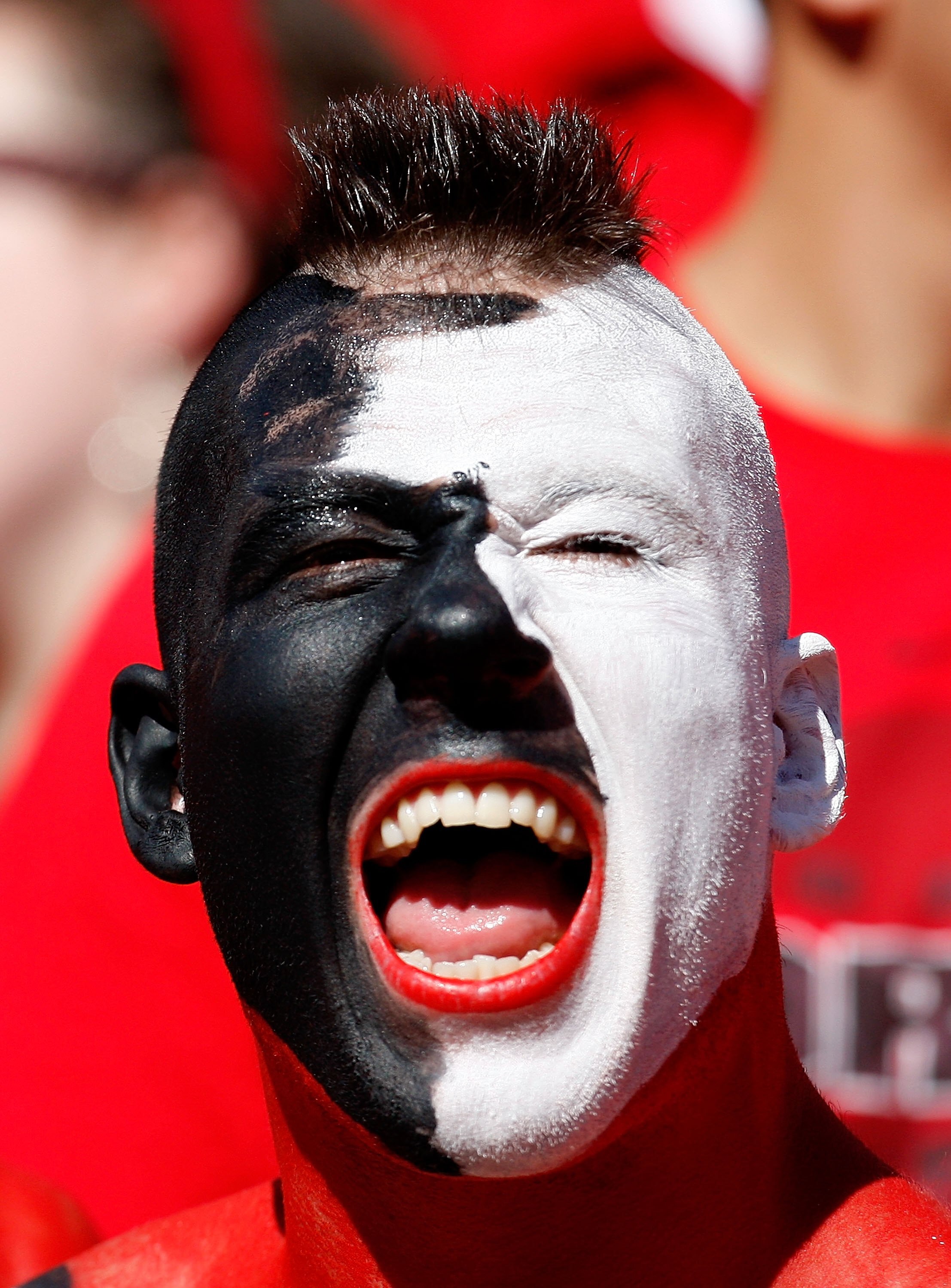 ATHENS, GA - OCTOBER 03:  A fan of the Georgia Bulldogs cheers against the Louisiana State University Tigers at Sanford Stadium on October 3, 2009 in Athens, Georgia.  (Photo by Kevin C. Cox/Getty Images)