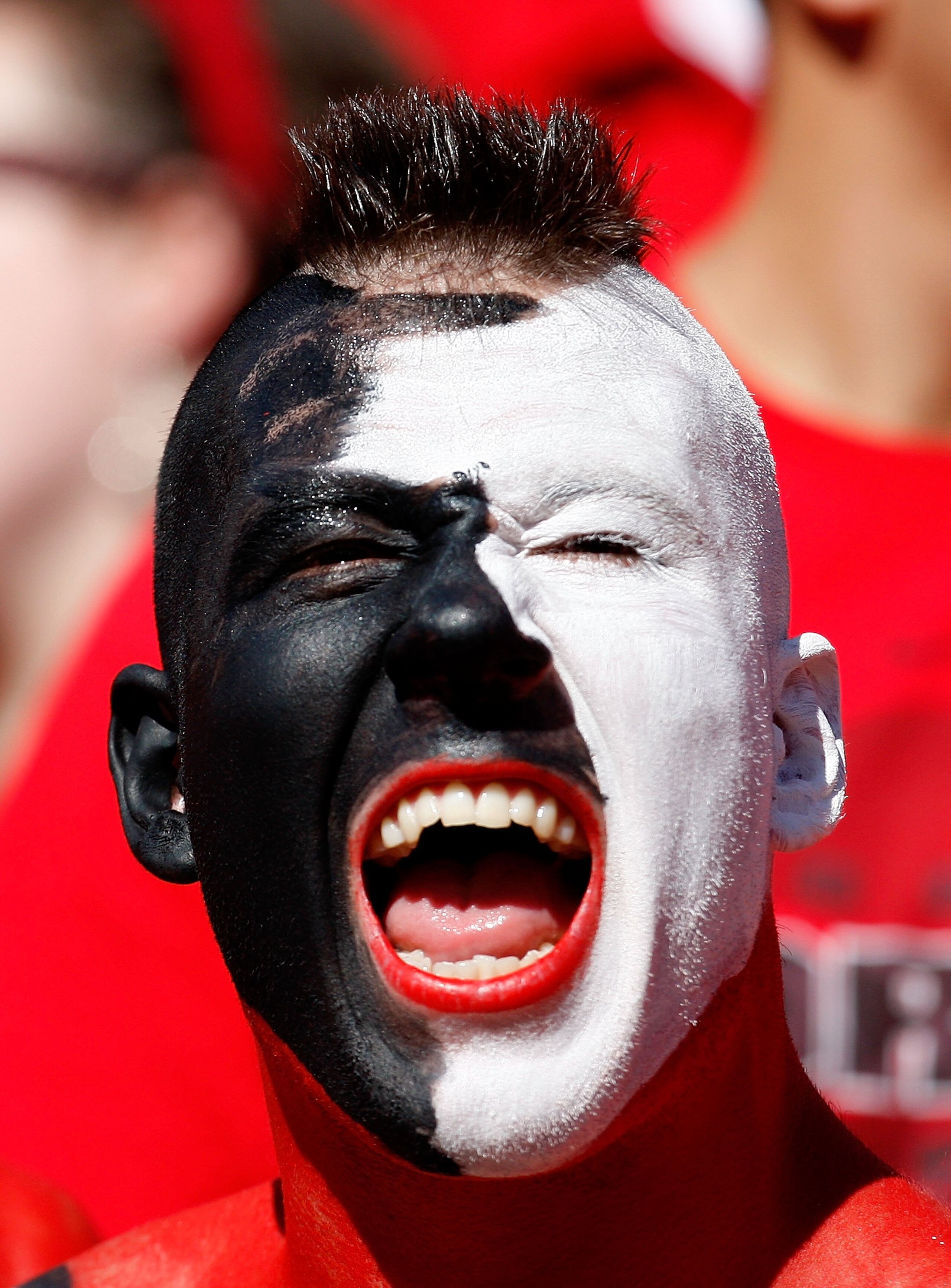 ATHENS, GA - OCTOBER 03:  A fan of the Georgia Bulldogs cheers against the Louisiana State University Tigers at Sanford Stadium on October 3, 2009 in Athens, Georgia.  (Photo by Kevin C. Cox/Getty Images)
