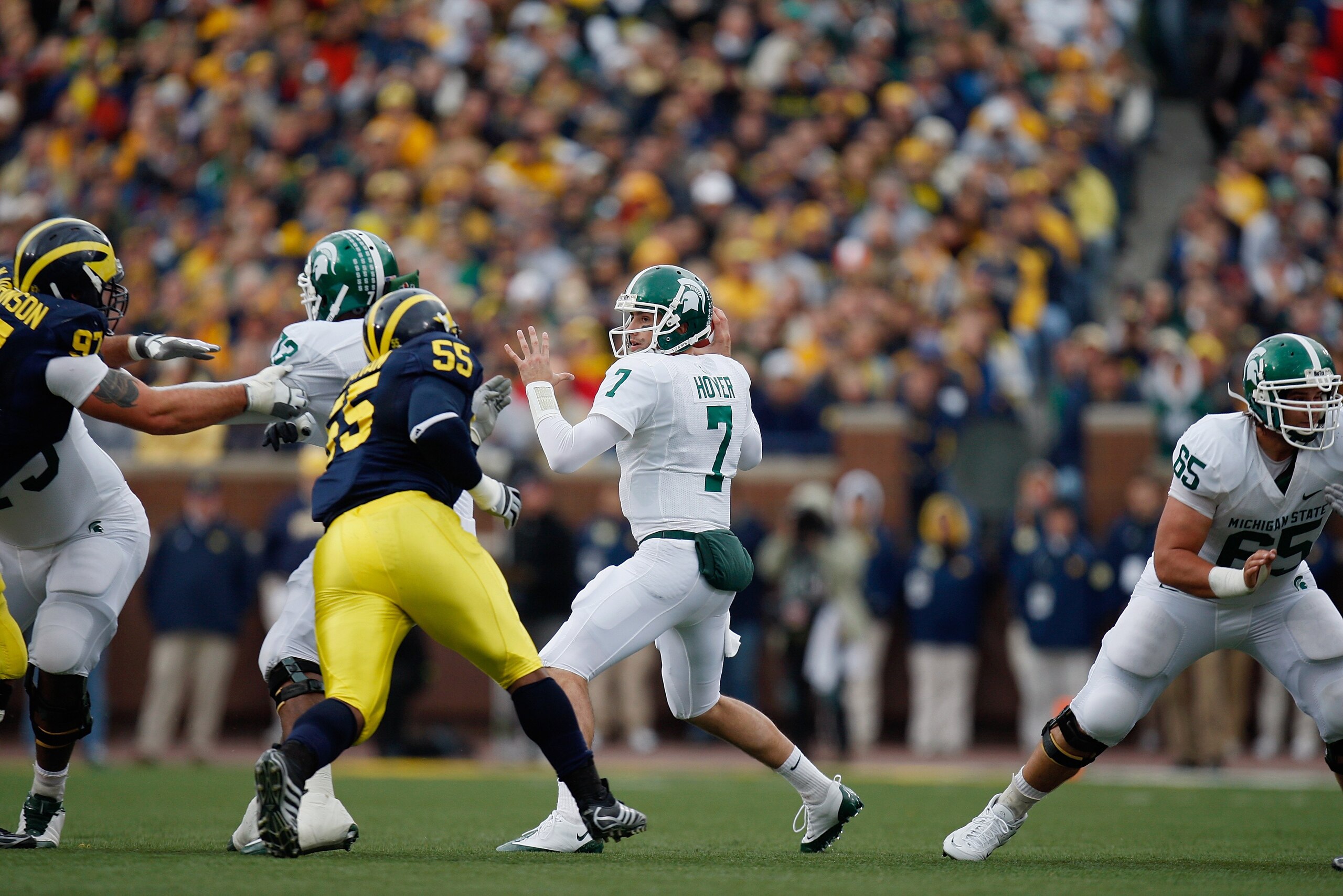 ANN ARBOR, MI - OCTOBER 25:  Brian Hoyer #7 of the Michigan State Spartans drops back to pass during the game against the Michigan Wolverines on October 25, 2008 at Michigan Stadium in Ann Arbor, Michigan. Michigan State won the game 35-21. (Photo by Greg