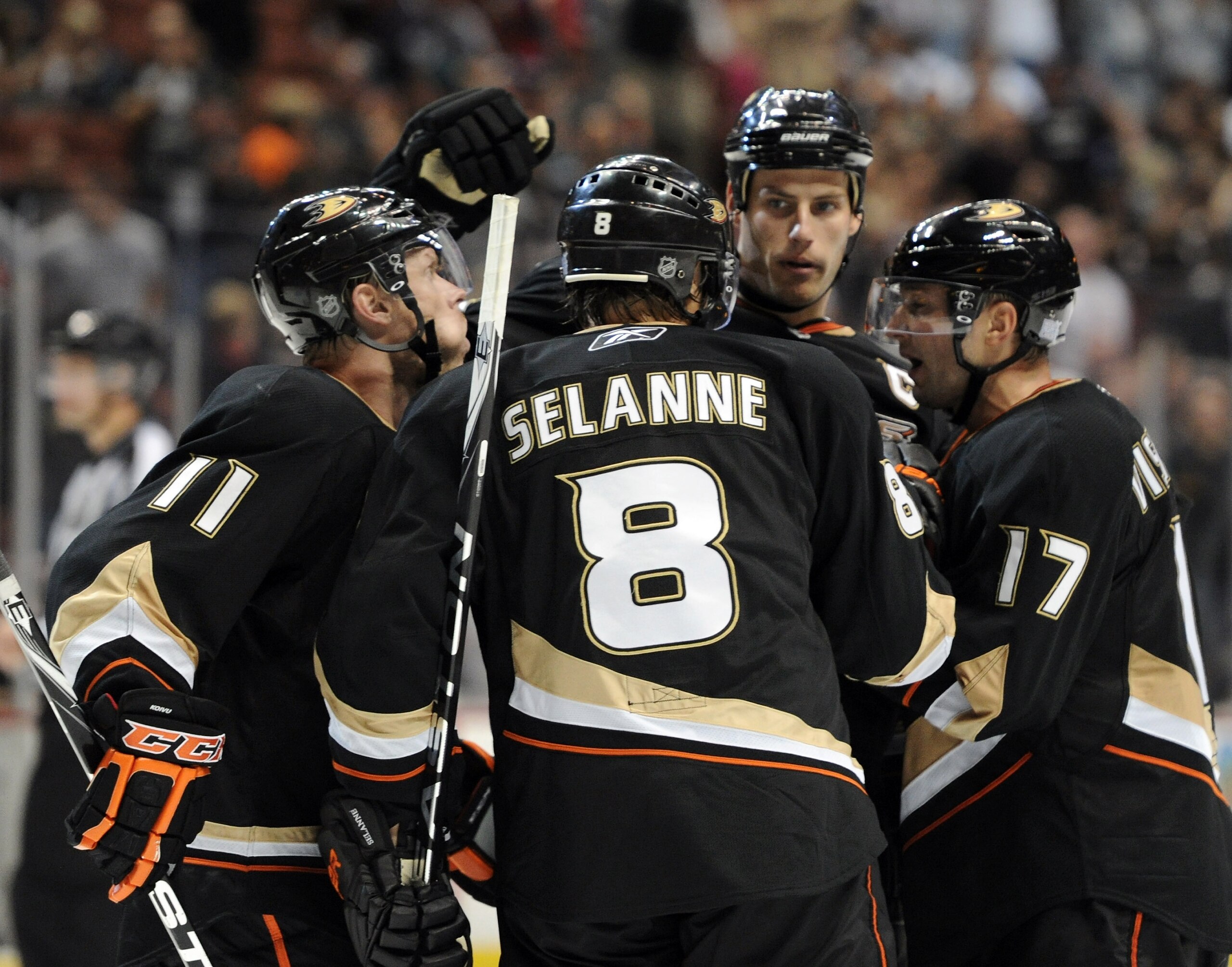 ANAHEIM, CA - OCTOBER 03:  Teemu Selanne #8 of the Anaheim Ducks celebrates his overtime goal with Saku Koivu #11, Ryan Getzlaf #15 and Lubomir Visnovsky #17 for a 3-2 win in overtime over the Los Angeles Kings at Honda Center on October 3, 2010 in Anahei