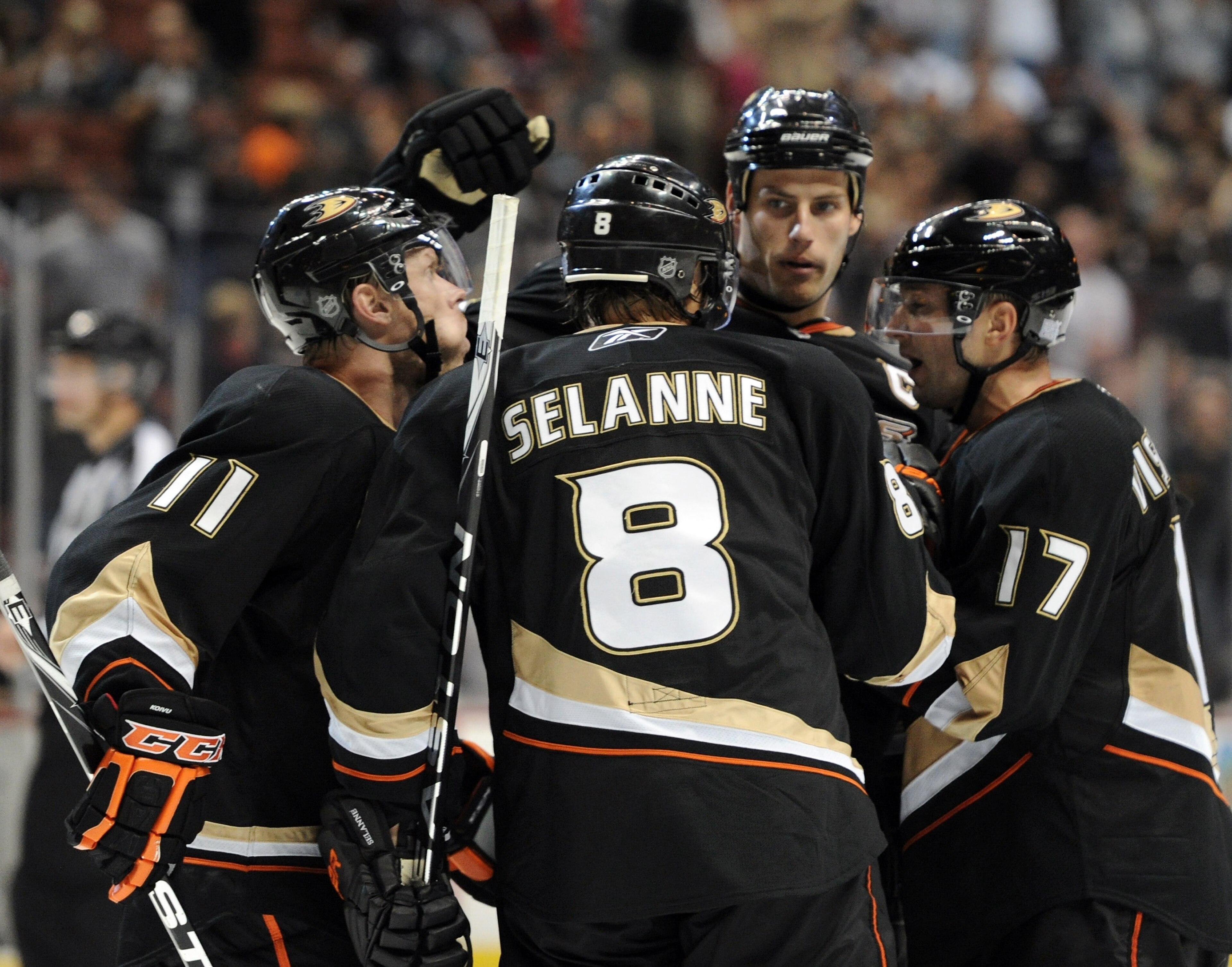 ANAHEIM, CA - OCTOBER 03:  Teemu Selanne #8 of the Anaheim Ducks celebrates his overtime goal with Saku Koivu #11, Ryan Getzlaf #15 and Lubomir Visnovsky #17 for a 3-2 win in overtime over the Los Angeles Kings at Honda Center on October 3, 2010 in Anahei