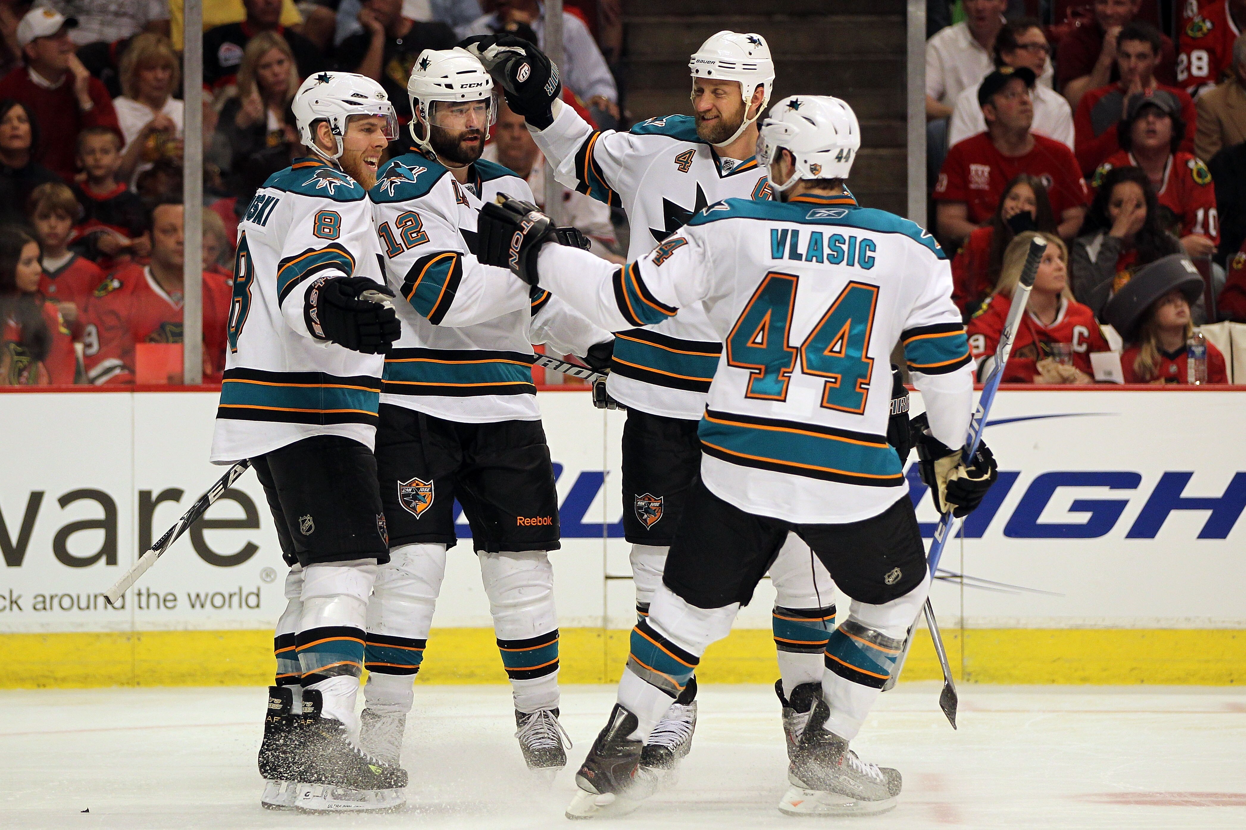 CHICAGO - MAY 23:  (2nd L) Patrick Marleau #12 of the San Jose Sharks celebrates his second period goal with teammates Joe Pavelski #8, Rob Blake #4 and Marc-Edouard Vlasic #44 while taking on the Chicago Blackhawks in Game Four of the Western Conference