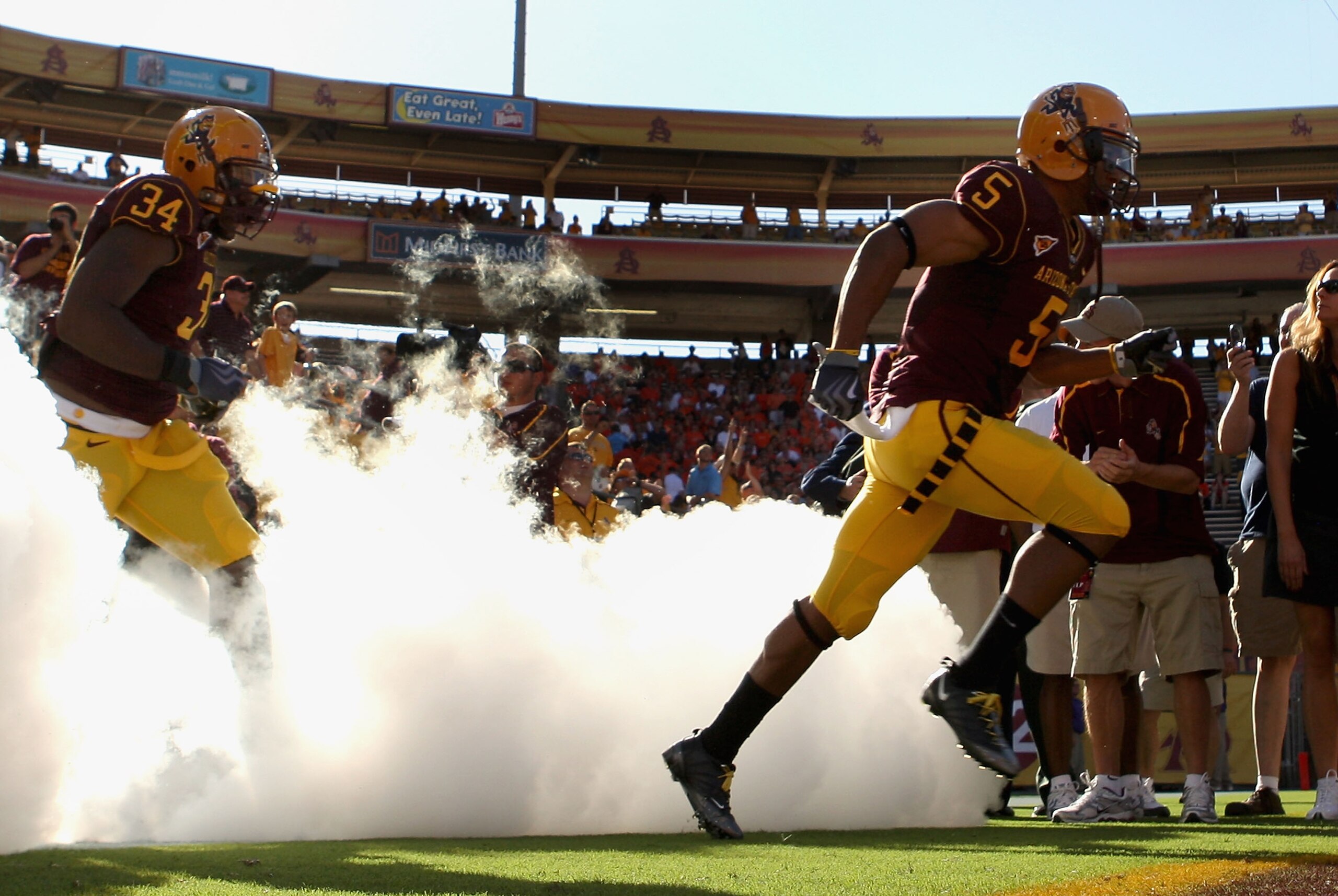 TEMPE, AZ - OCTOBER 03:  Kerry Taylor #5 and James Brooks #34 of the Arizona State Sun Devils runs out onto the field before the college football game against the Oregon State Beavers at Sun Devil Stadium on October 3, 2009 in Tempe, Arizona. The Beavers 