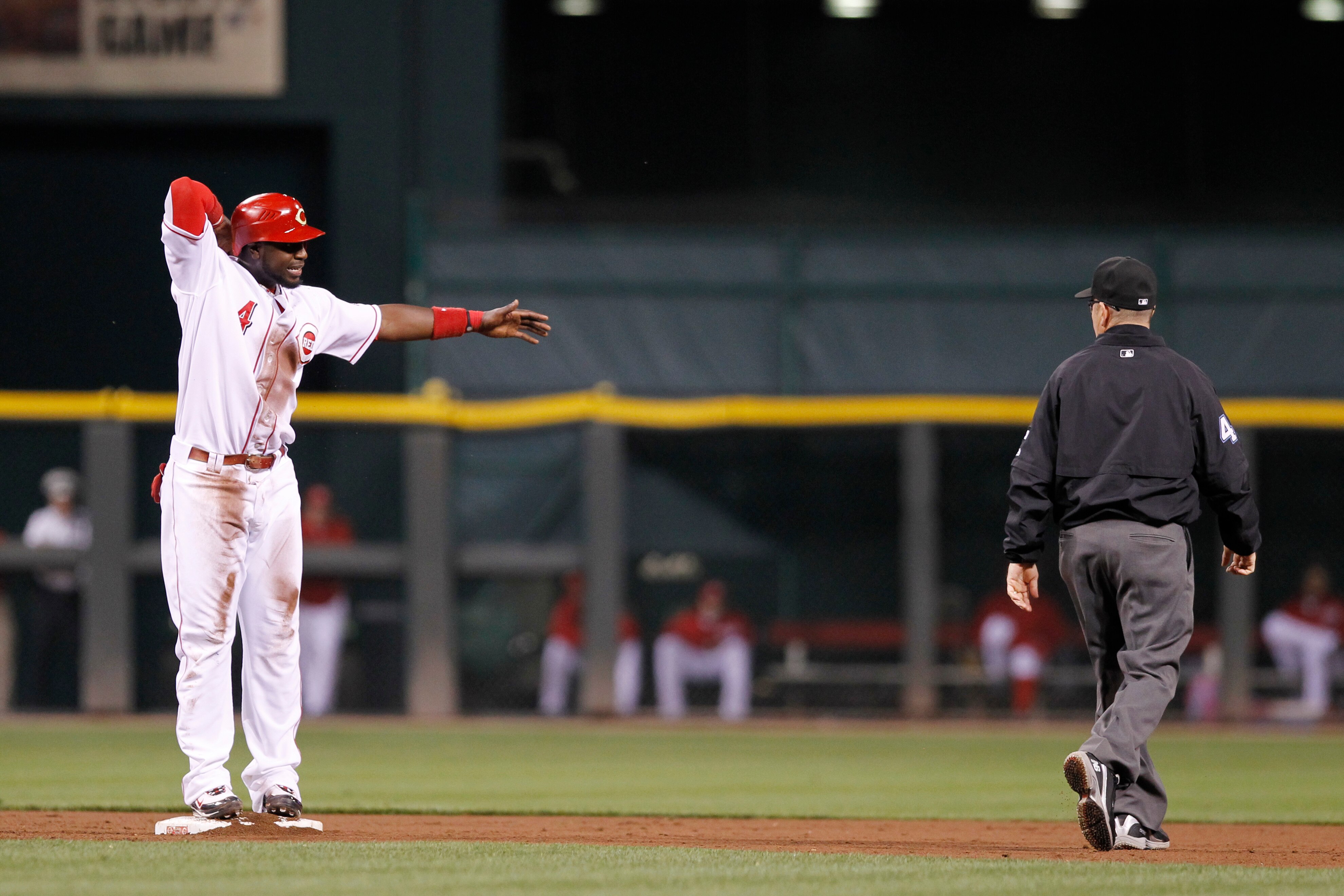 CINCINNATI, OH - SEPTEMBER 28: Brandon Phillips #4 of the Cincinnati Reds argues with second base umpire Jerry Meals after being called out against the Houston Astros at Great American Ball Park on September 28, 2010 in Cincinnati, Ohio. The Reds won 3-2