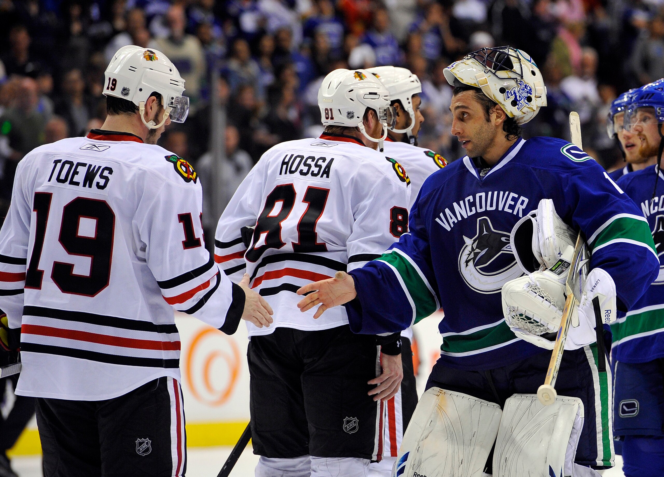 VANCOUVER, CANADA - MAY 11:  Goalie Roberto Luongo #1 of the Vancouver Canucks shakes hands with Jonathan Toews #19 of the Chicago Blackhawks after the Blackhawks defeated the Canucks 5-1 to win Game Six of the Western Conference Semifinals to win the ser
