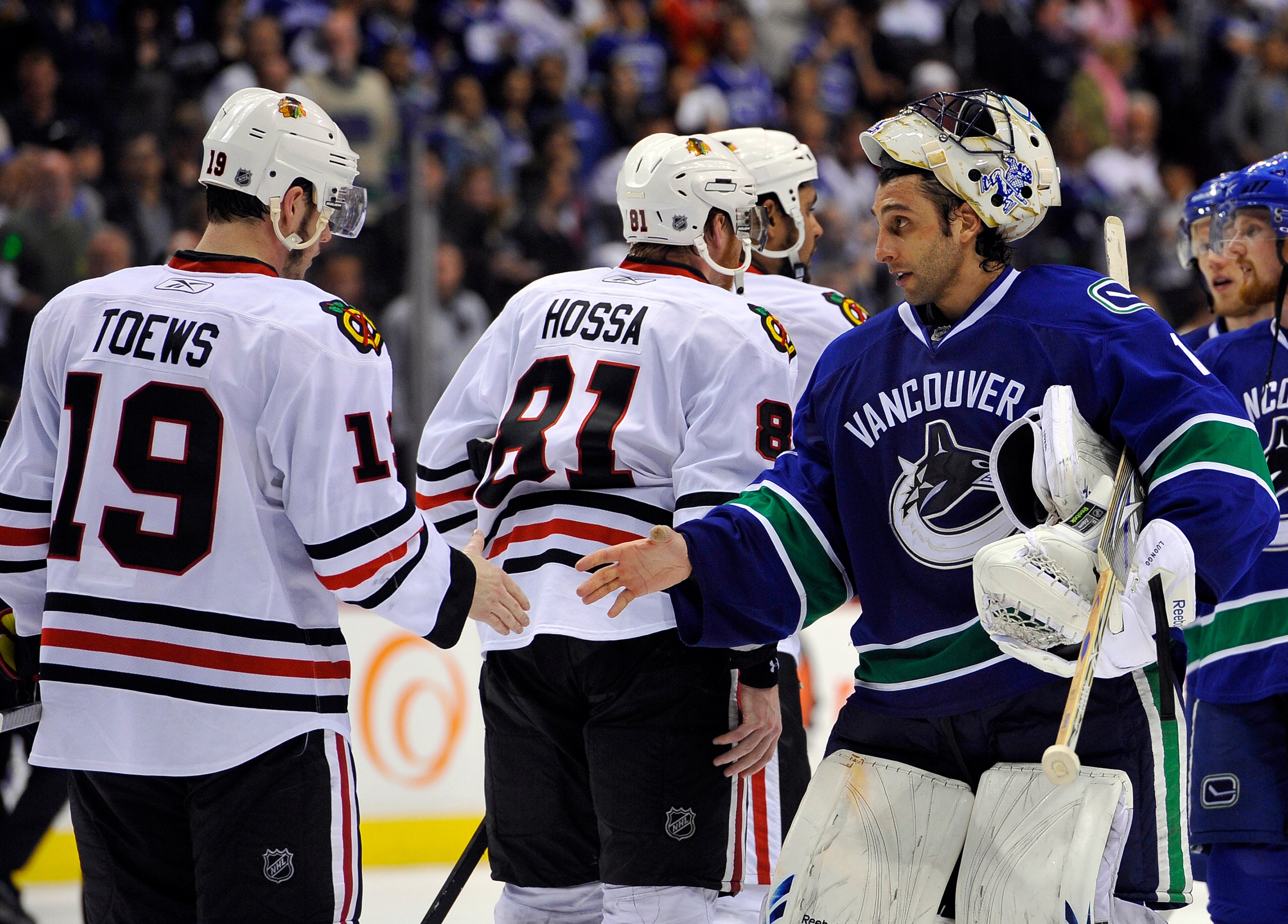 VANCOUVER, CANADA - MAY 11:  Goalie Roberto Luongo #1 of the Vancouver Canucks shakes hands with Jonathan Toews #19 of the Chicago Blackhawks after the Blackhawks defeated the Canucks 5-1 to win Game Six of the Western Conference Semifinals to win the ser