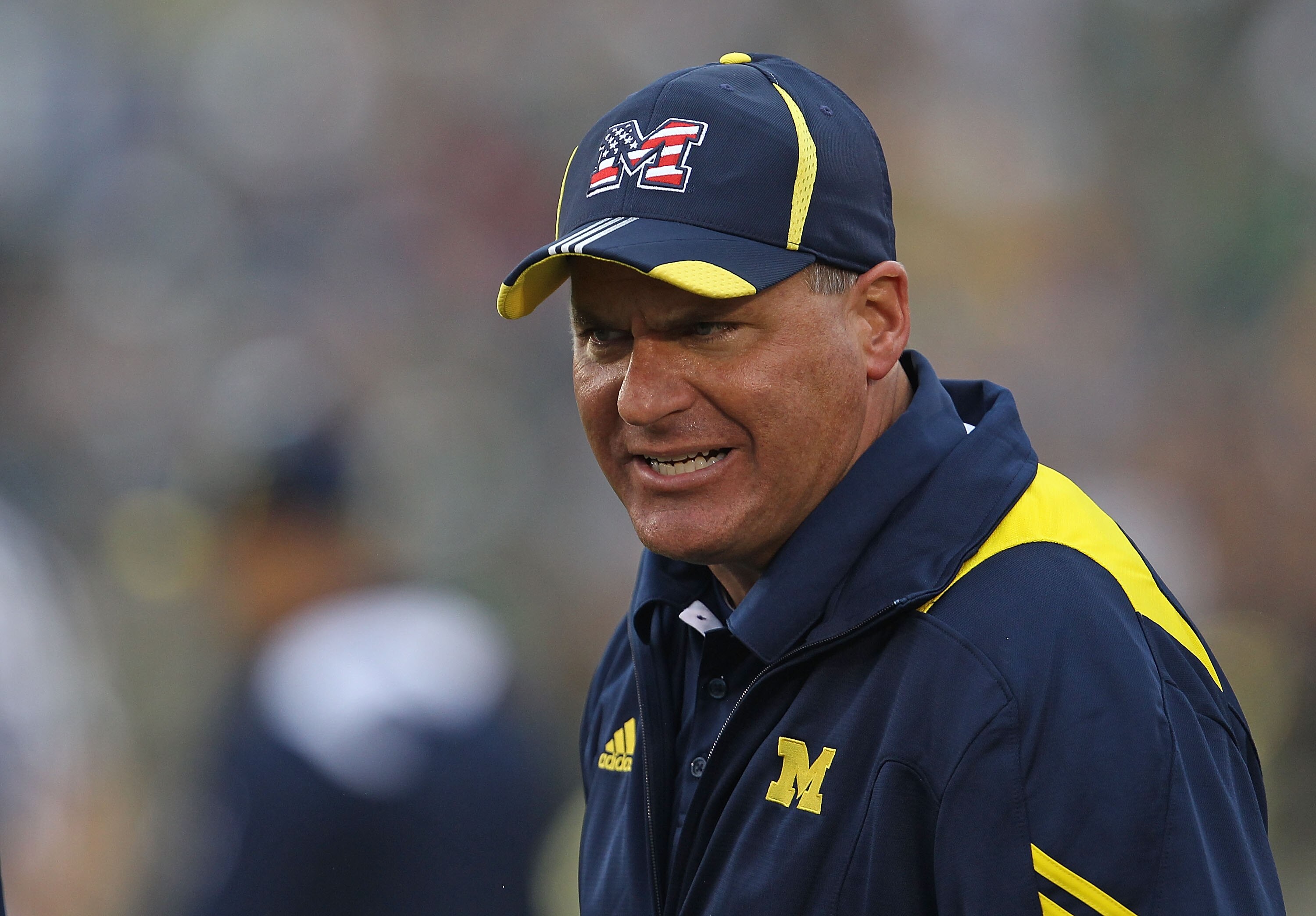 SOUTH BEND, IN - SEPTEMBER 11: Head coach Rich Rodriguez of the Michigan Wolverines yells at an assistant coach during a game against the Notre Dame Fighting Irish at Notre Dame Stadium on September 11, 2010 in South Bend, Indiana. Michigan defeated Notre