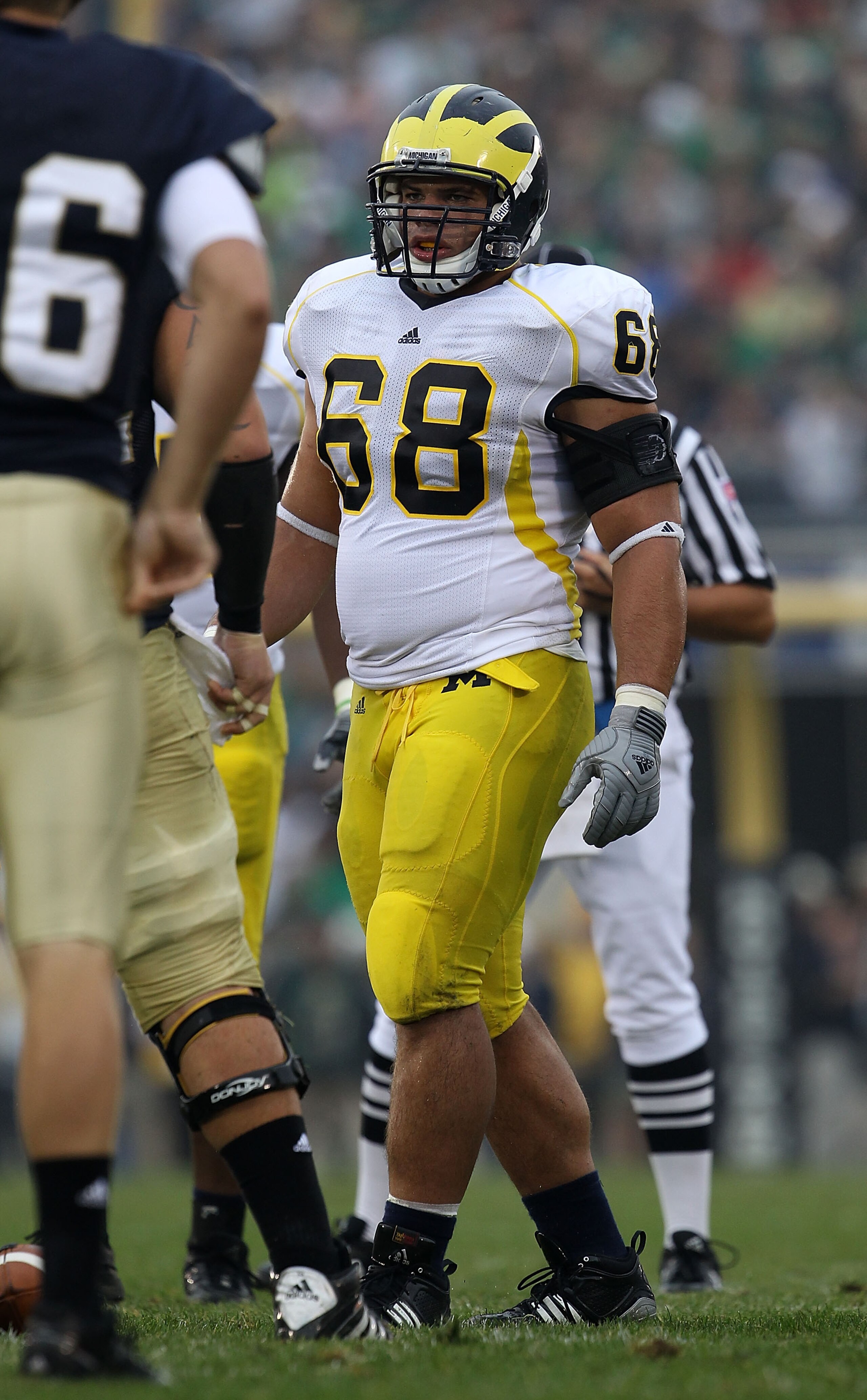 SOUTH BEND, IN - SEPTEMBER 11: Mike Martin #68 of the Michigan Wolverines awaits the start of play against the Notre Dame Fighting Irish at Notre Dame Stadium on September 11, 2010 in South Bend, Indiana. Michigan defeated Notre Dame 28-24.  (Photo by Jon