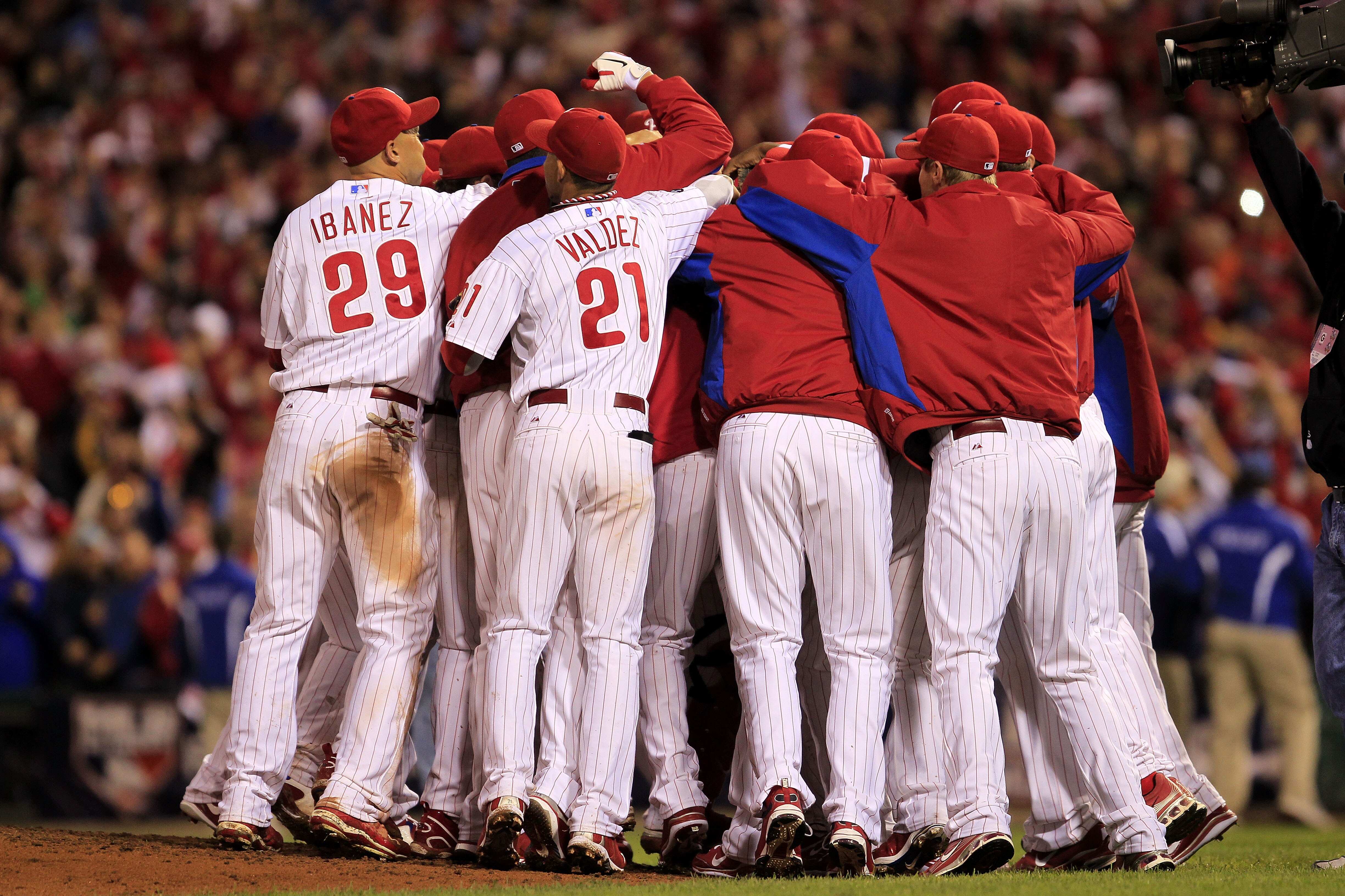 PHILADELPHIA - OCTOBER 06: Roy Halladay #34 of the Philadelphia Phillies is mobbed by teammates after pitching a no-hitter and the win in Game 1 of the NLDS against the Cincinnati Reds at Citizens Bank Park on October 6, 2010 in Philadelphia, Pennsylvania