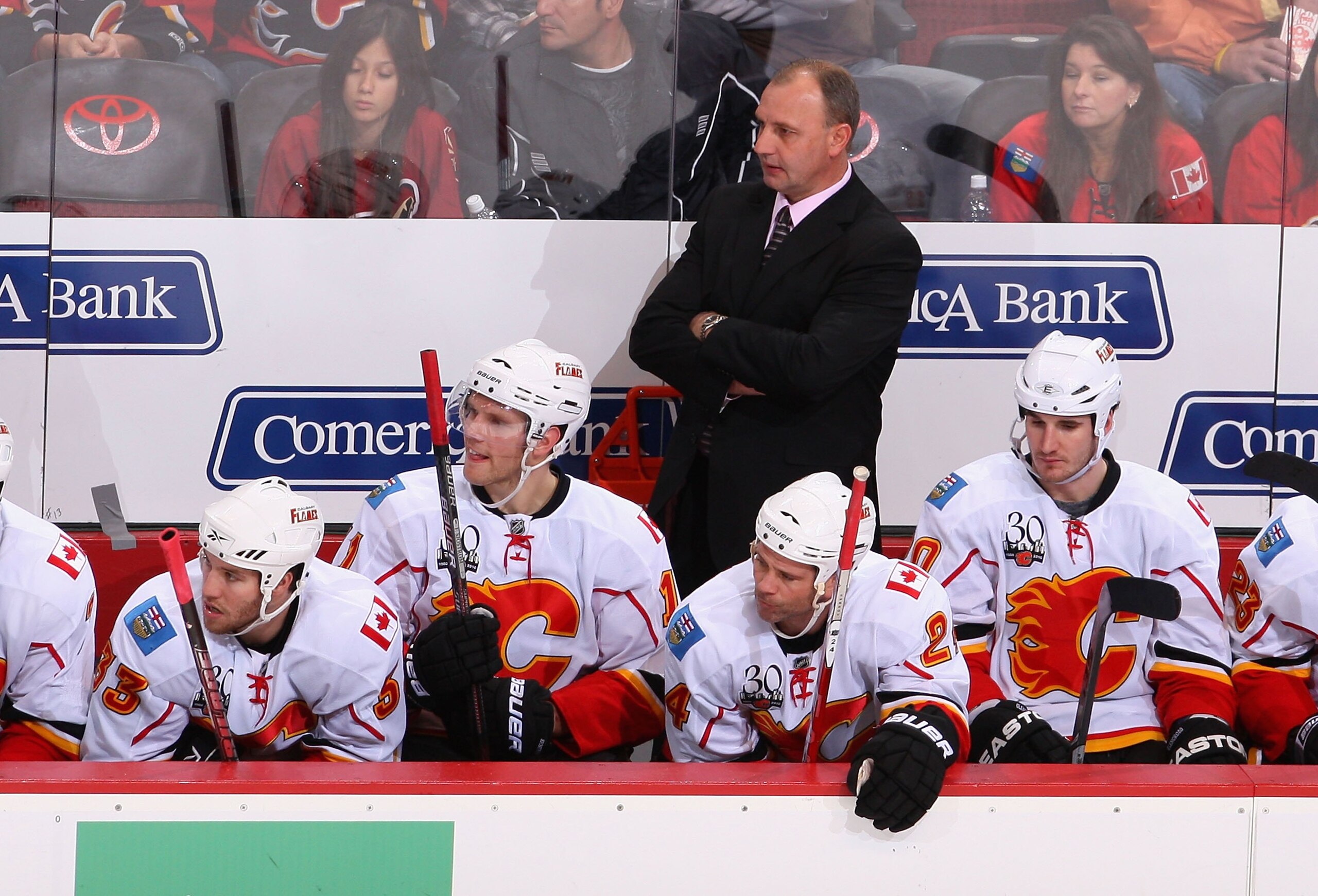 GLENDALE, AZ - DECEMBER 03:  Head coach Brent Sutter of the Calgary Flames looks on from the bench during the NHL game against the Phoenix Coyotes at Jobing.com Arena on December 3, 2009 in Glendale, Arizona.  The Coyotes defeated the Flames 2-1.  (Photo