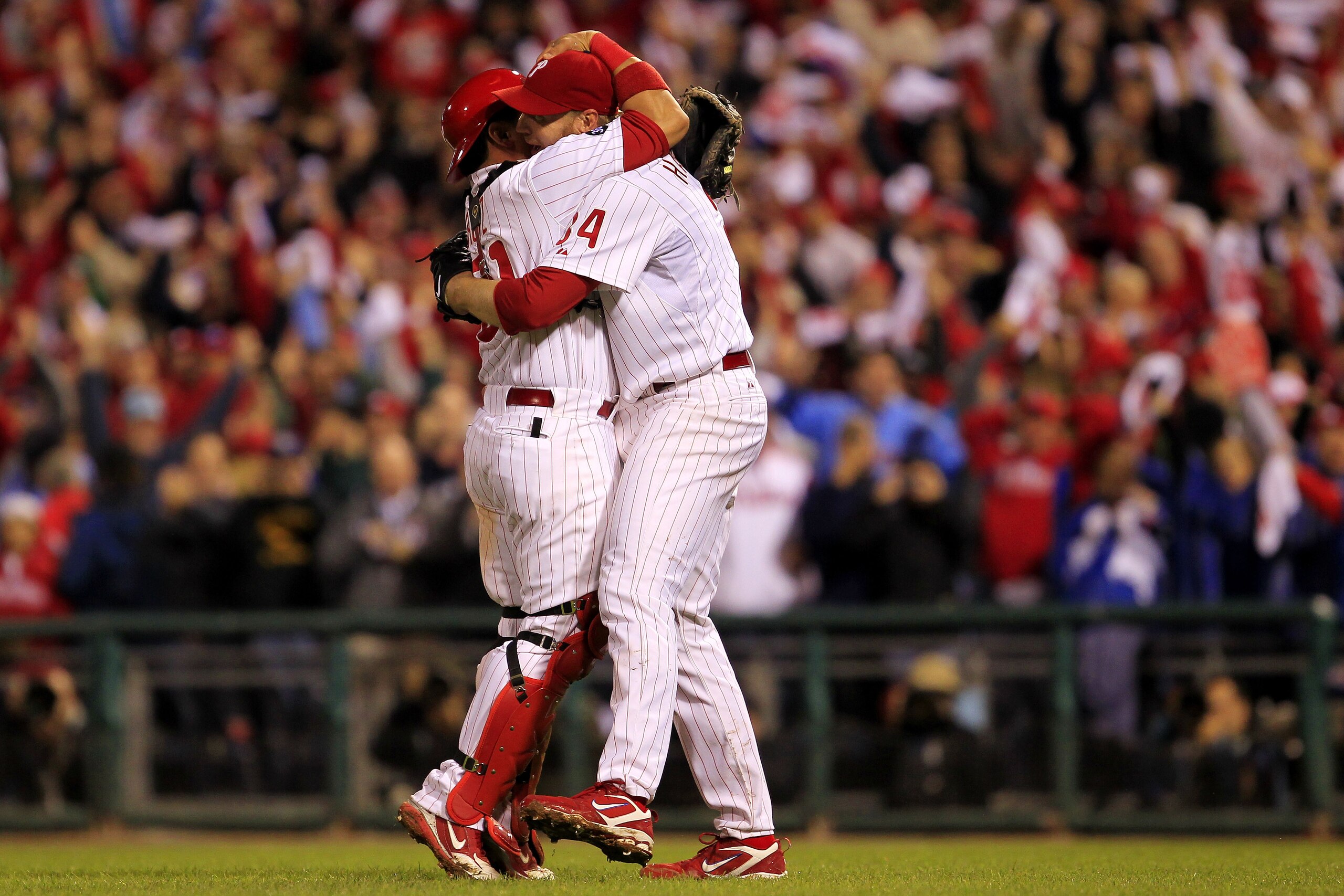 PHILADELPHIA - OCTOBER 06:  Roy Halladay #34 and Carlos Ruiz #51 of the Philadelphia Phillies celebrate Halladay's no-hitter and the win in Game 1 of the NLDS against the Cincinnati Reds at Citizens Bank Park on October 6, 2010 in Philadelphia, Pennsylvan