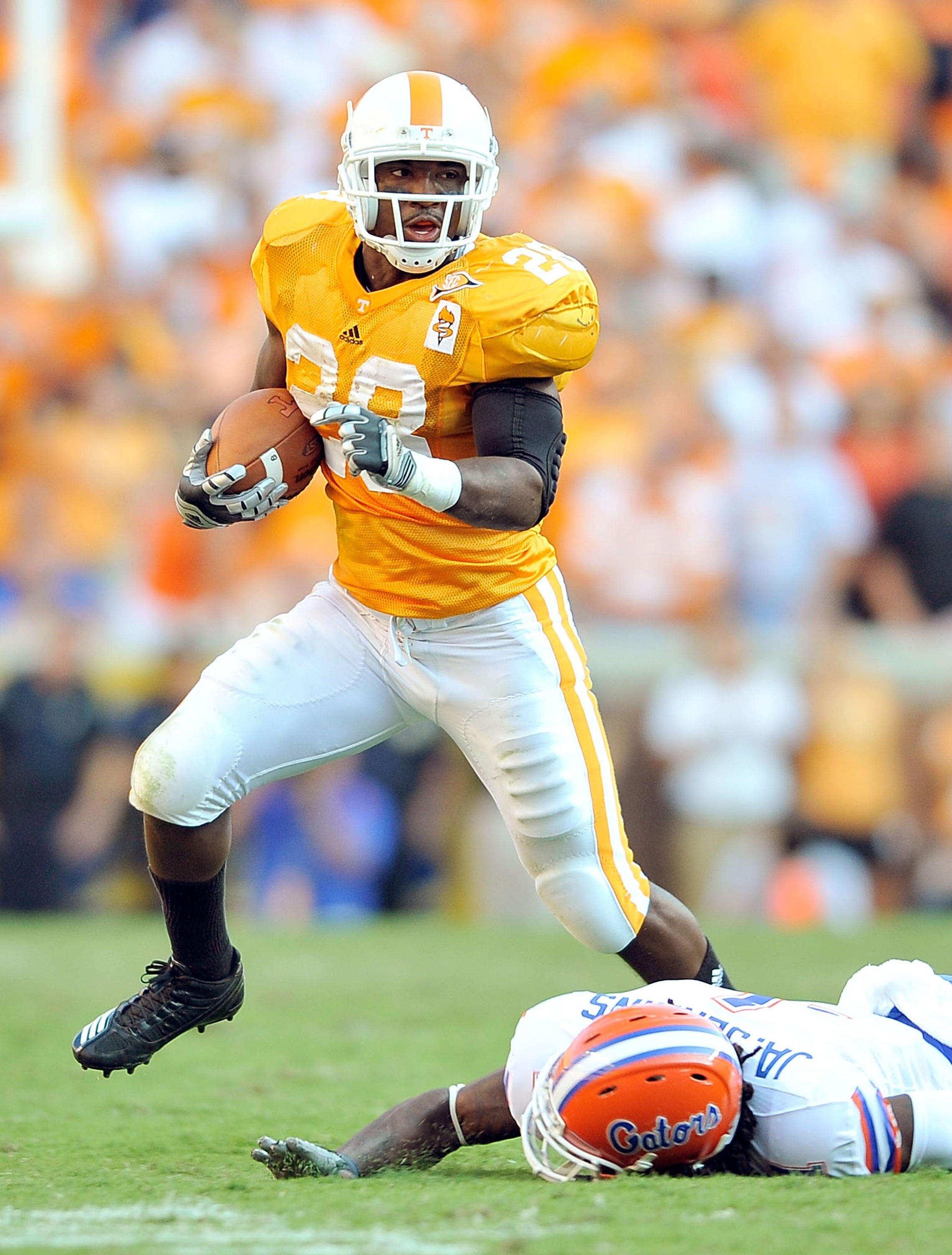 KNOXVILLE, TN - SEPTEMBER 18: Tauren Poole #28 of the Tennessee Volunteers breaks away from Janoris Jenkins #1 of the Florida Gators at Neyland Stadium on September 18, 2010 in Knoxville, Tennessee. Florida won 31-17.  (Photo by Grant Halverson/Getty Imag