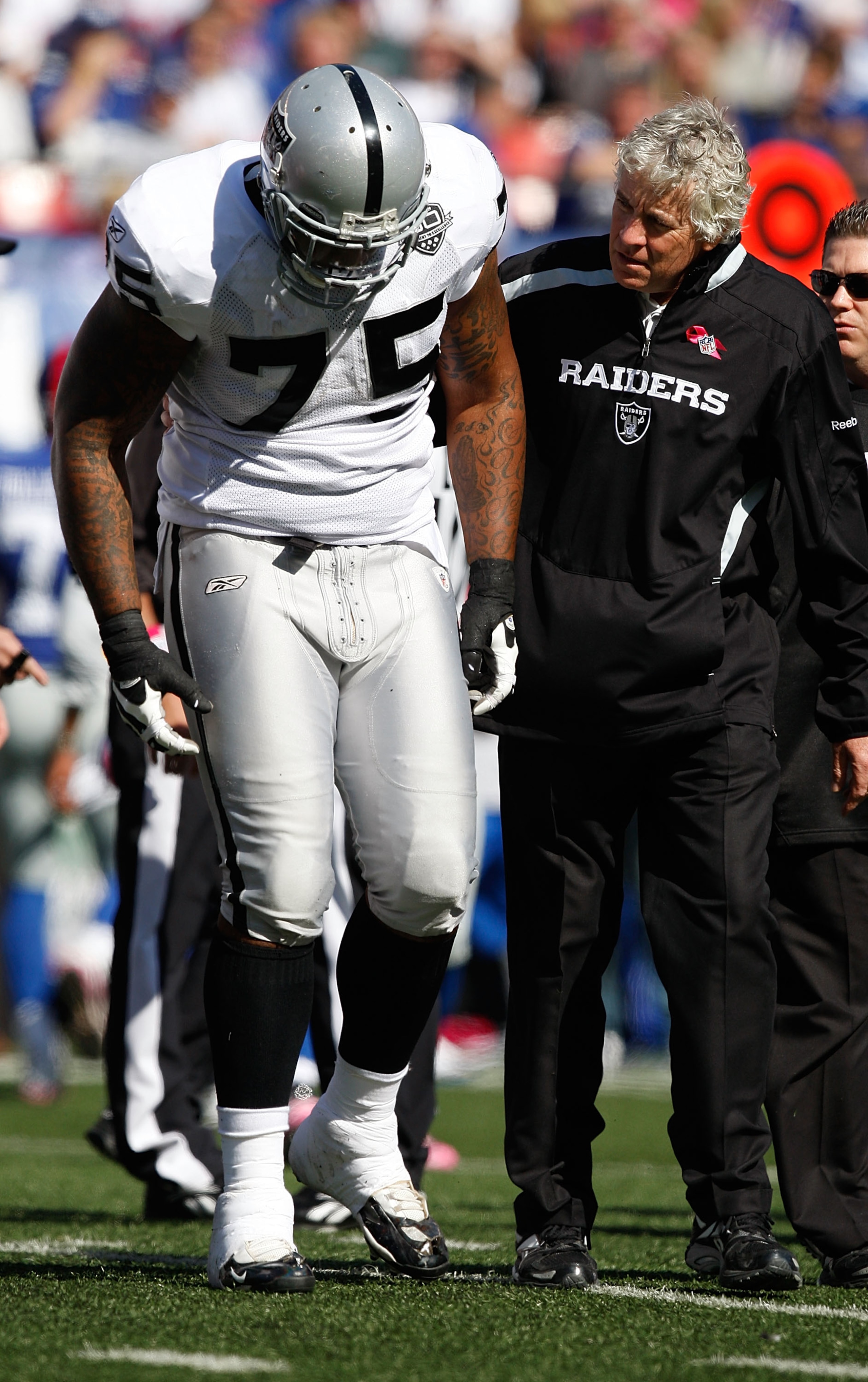 EAST RUTHERFORD, NJ - OCTOBER 11: Mario Henderson #75 of the Oakland Raiders walks off the field with an injury during the game against the New York Giants on October 11, 2009 at Giants Stadium in East Rutherford, New Jersey. (Photo by Jared Wickerham/Get