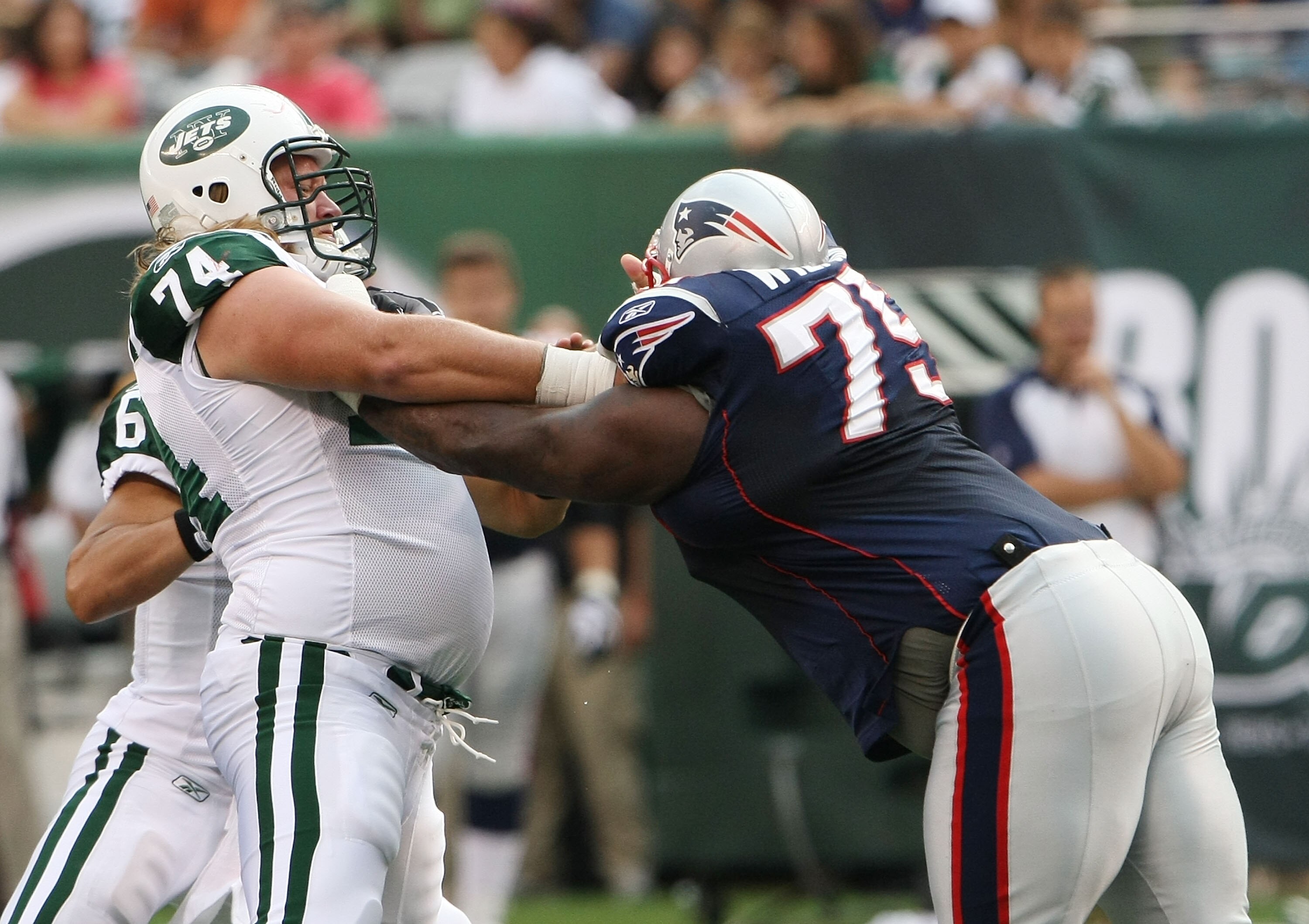 EAST RUTHERFORD, NJ - SEPTEMBER 19: Nick Mangold #74 of the New York Jets blocks Vince Wilfork #74 of the New England Patriots during their game on September 19, 2010 at the New Meadowlands Stadium in East Rutherford, New Jersey. (Photo by Al Bello/Ge EAST RUTHERFORD, NJ - SEPTEMBER 19: Nick Mangold #74 of the New York Jets blocks Vince Wilfork #74 of the New England Patriots during their game on September 19, 2010 at the New Meadowlands Stadium in East Rutherford, New Jersey. (Photo by Al Bello/Ge