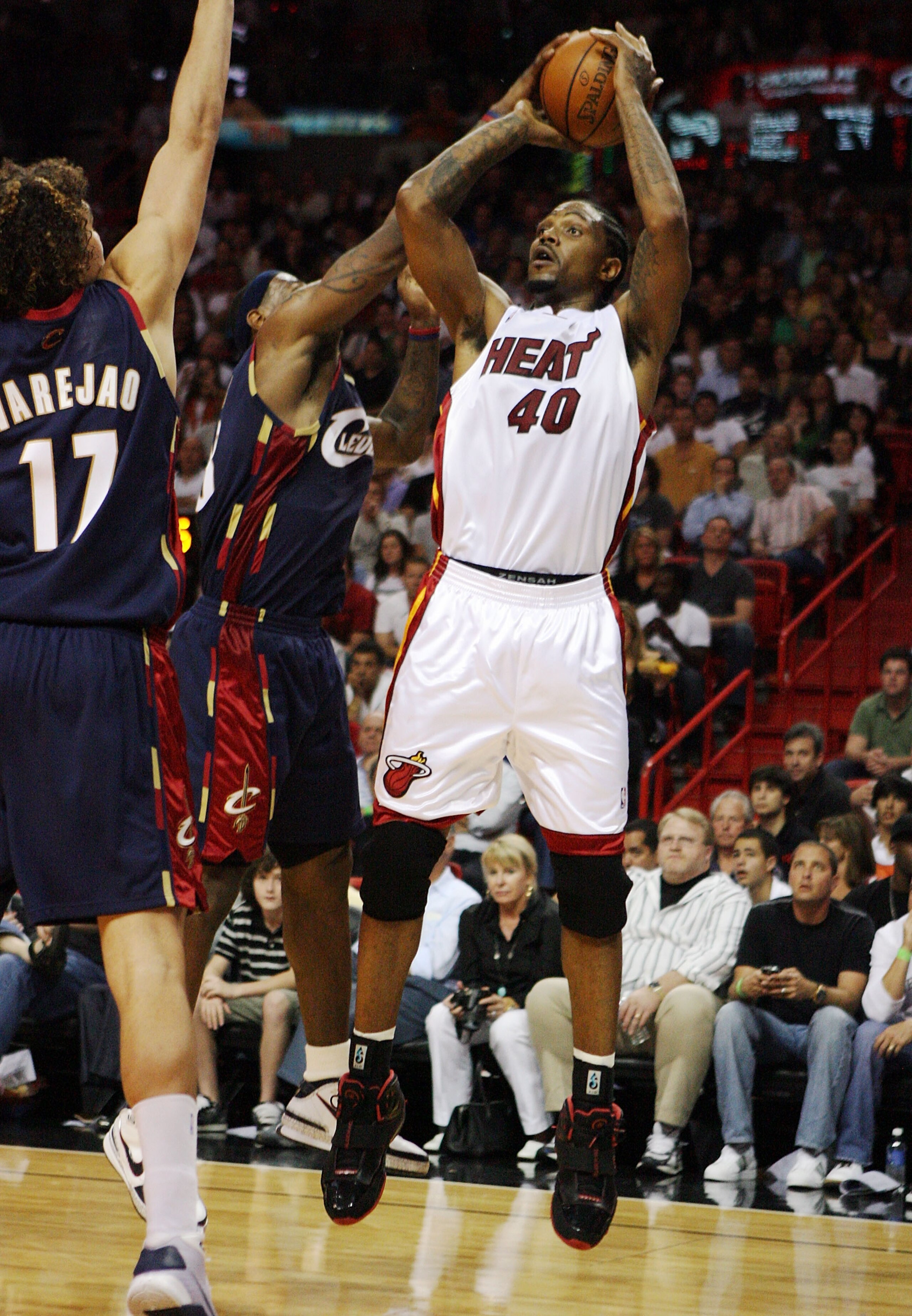 MIAMI - DECEMBER 30:  LeBron James #23 of the Cleveland Cavaliers blocks a shot attempt by Udonis Haslem #40 of the Miami Heat at American Airlines Arena on December 30, 2008 in Miami, Florida. The Heat defeated the Cavaliers 104-95. NOTE TO USER: User ex