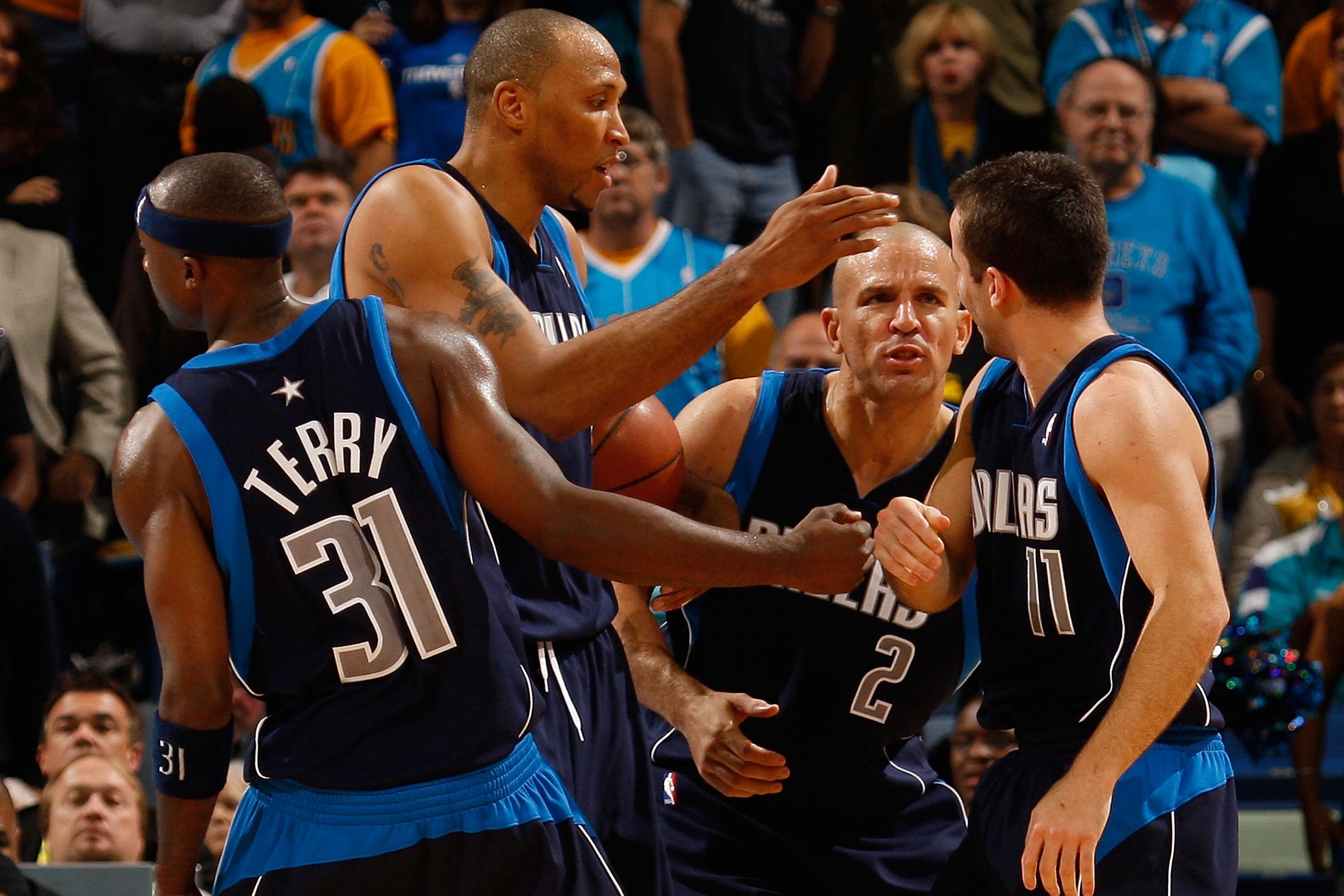 NEW ORLEANS - NOVEMBER 04:  Jason Terry #31, Shawn Marion #0, Jason Kidd #2  congratulate Jose Barea #11 of the Dallas Mavericks during the game against the New Orleans Hornets at New Orleans Arena on November 4, 2009 in New Orleans, Louisiana.  NOTE TO U