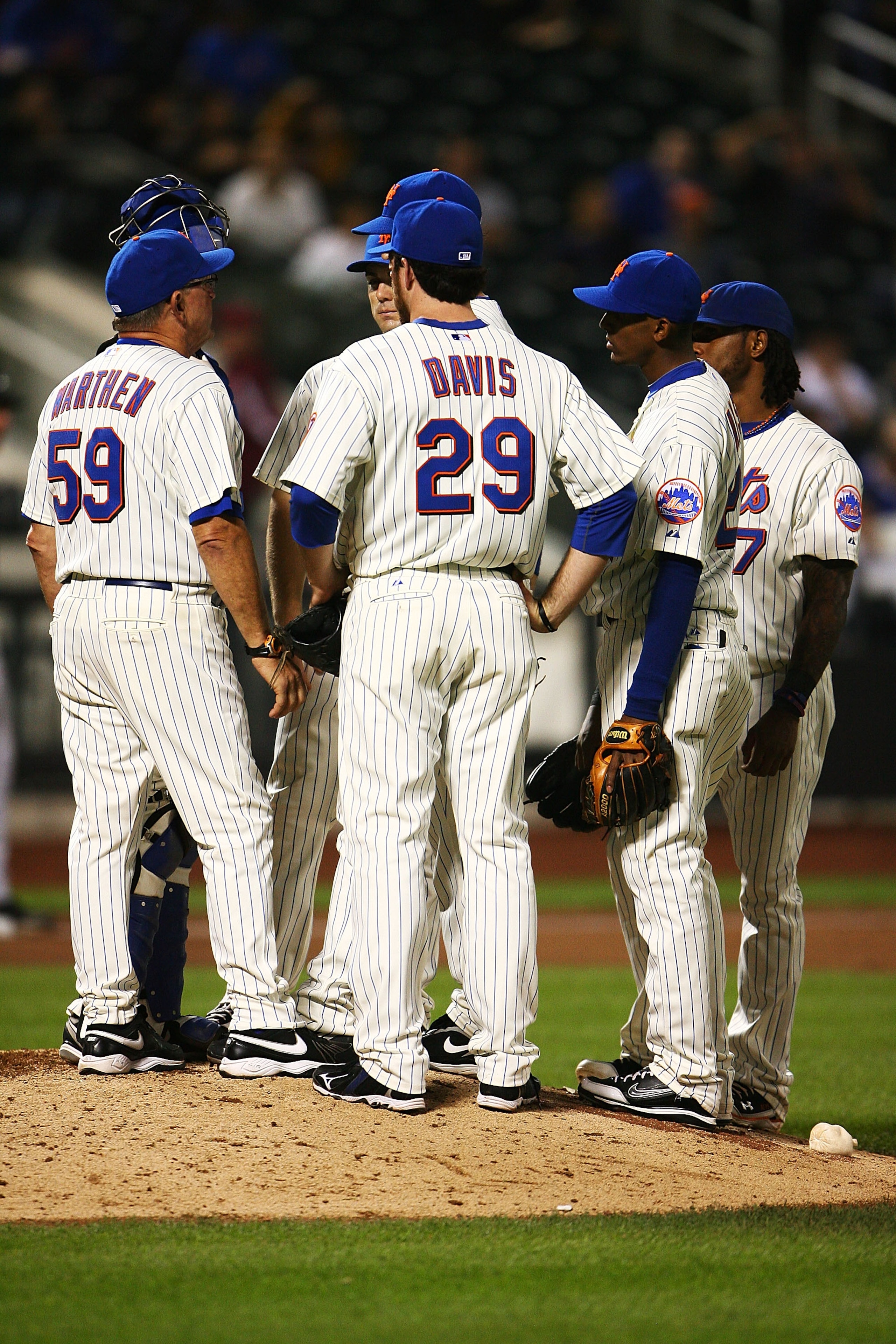NEW YORK - SEPTEMBER 30: The New York Mets hold a team meeting on the mound in the ninth inning during their game against the Milwaukee Brewers on September 30, 2010 at Citi Field in the Flushing neighborhood of the Queens borough of New York City. The B NEW YORK - SEPTEMBER 30: The New York Mets hold a team meeting on the mound in the ninth inning during their game against the Milwaukee Brewers on September 30, 2010 at Citi Field in the Flushing neighborhood of the Queens borough of New York City. The B