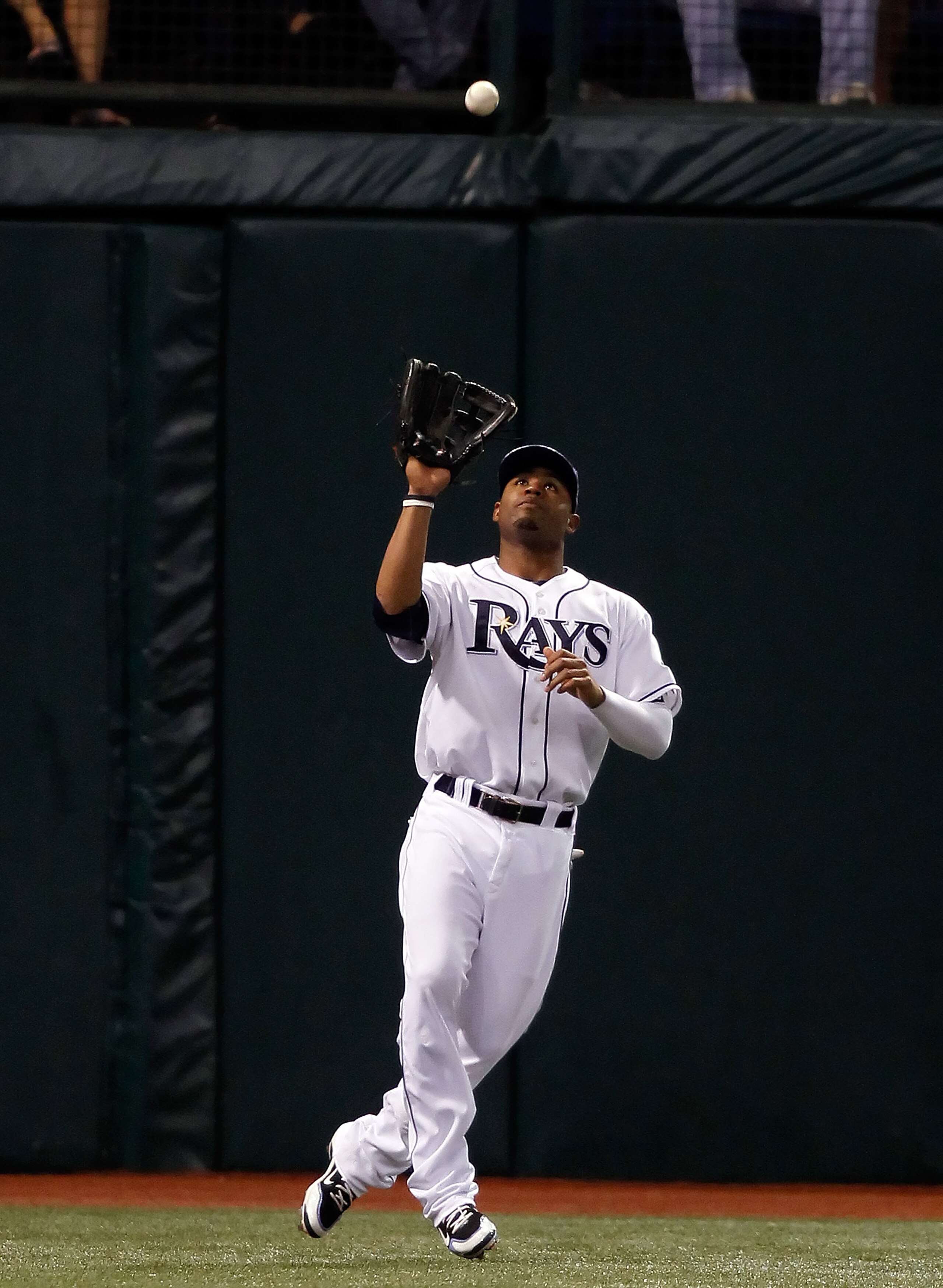 ST. PETERSBURG, FL - SEPTEMBER 29: Outfielder Carl Crawford #13 of the Tampa Bay Rays catches a fly ball against the Baltimore Orioles during the game at Tropicana Field on September 29, 2010 in St. Petersburg, Florida. (Photo by J. Meric/Getty Images) ST. PETERSBURG, FL - SEPTEMBER 29: Outfielder Carl Crawford #13 of the Tampa Bay Rays catches a fly ball against the Baltimore Orioles during the game at Tropicana Field on September 29, 2010 in St. Petersburg, Florida. (Photo by J. Meric/Getty Images)