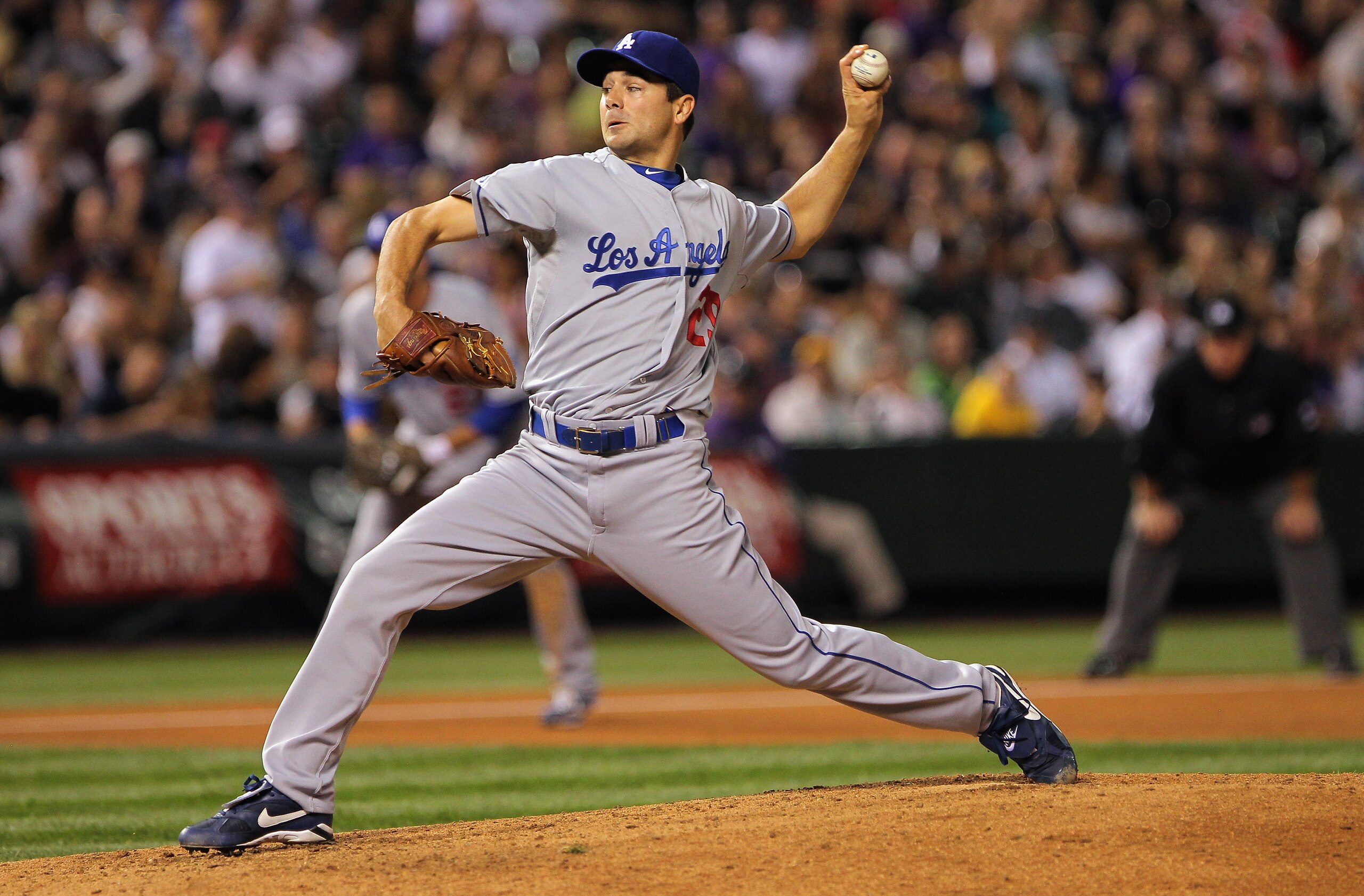 DENVER - SEPTEMBER 27: Starting pitcher Ted Lilly #29 of the Los Angeles Dodgers delivers against the Colorado Rockies at Coors Field on September 25, 2010 in Denver, Colorado. Lilly earned the win as the Dodgers defeated the Rockies 3-1. (Photo by Doug DENVER - SEPTEMBER 27: Starting pitcher Ted Lilly #29 of the Los Angeles Dodgers delivers against the Colorado Rockies at Coors Field on September 25, 2010 in Denver, Colorado. Lilly earned the win as the Dodgers defeated the Rockies 3-1. (Photo by Doug