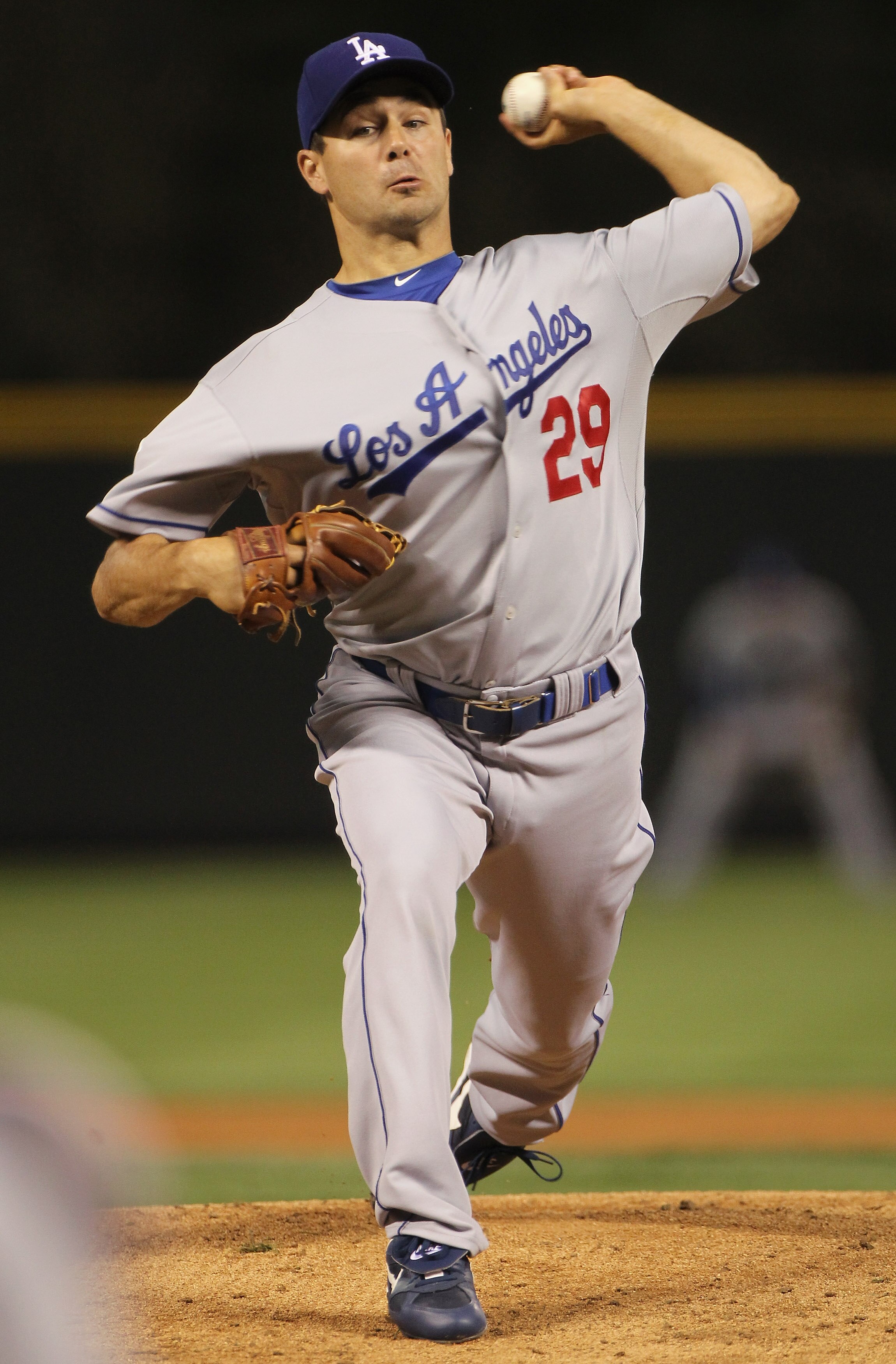 DENVER - SEPTEMBER 27:  Starting pitcher Ted Lilly #29 of the Los Angeles Dodgers delivers against the Colorado Rockies at Coors Field on September 25, 2010 in Denver, Colorado.  (Photo by Doug Pensinger/Getty Images)