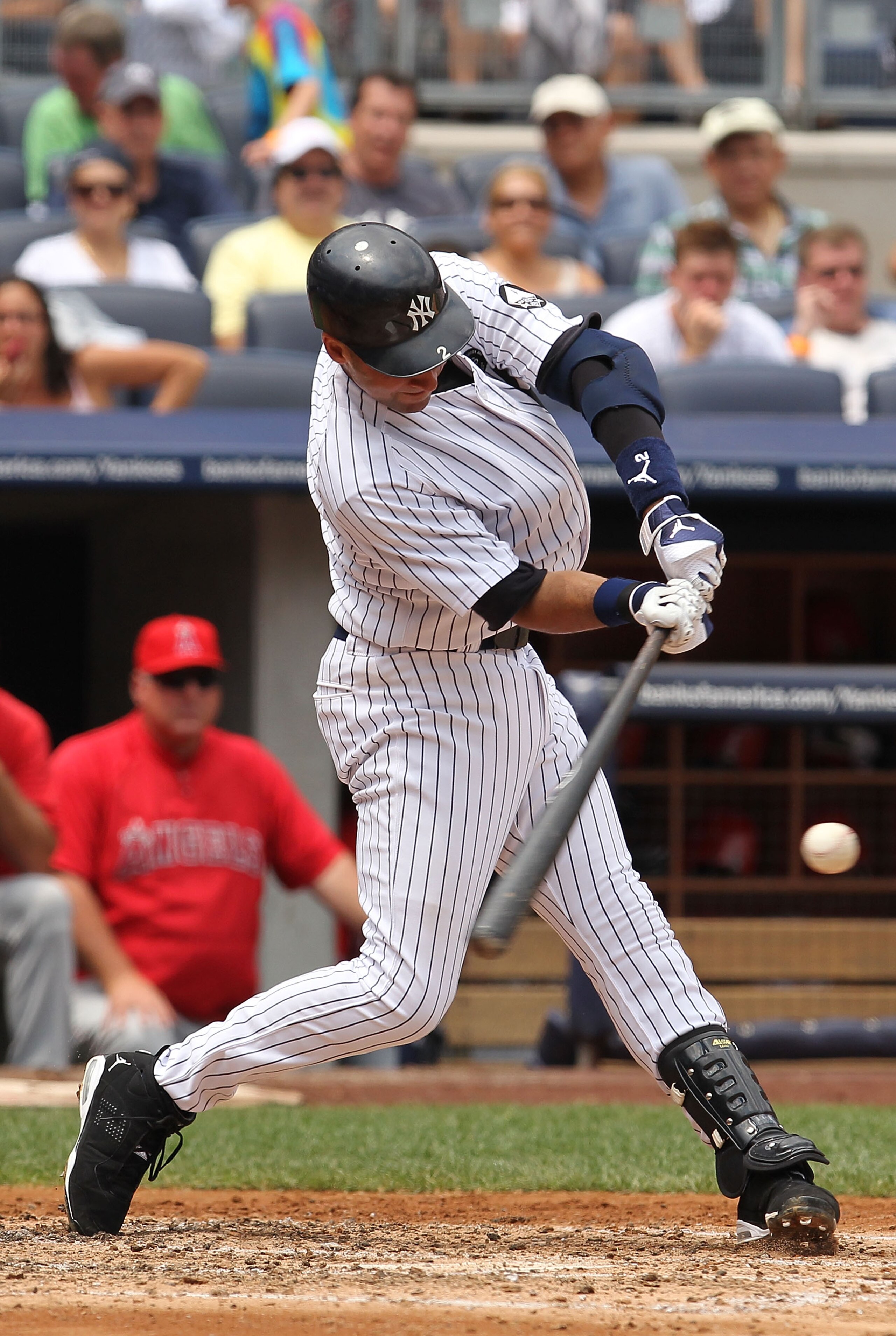 NEW YORK - JULY 21:  Derek Jeter #2 of the New York Yankees hits a single against the Los Angeles Angels of Anaheim during their game on July 21, 2010 at Yankee Stadium in the Bronx Borough of New York City.  (Photo by Al Bello/Getty Images)