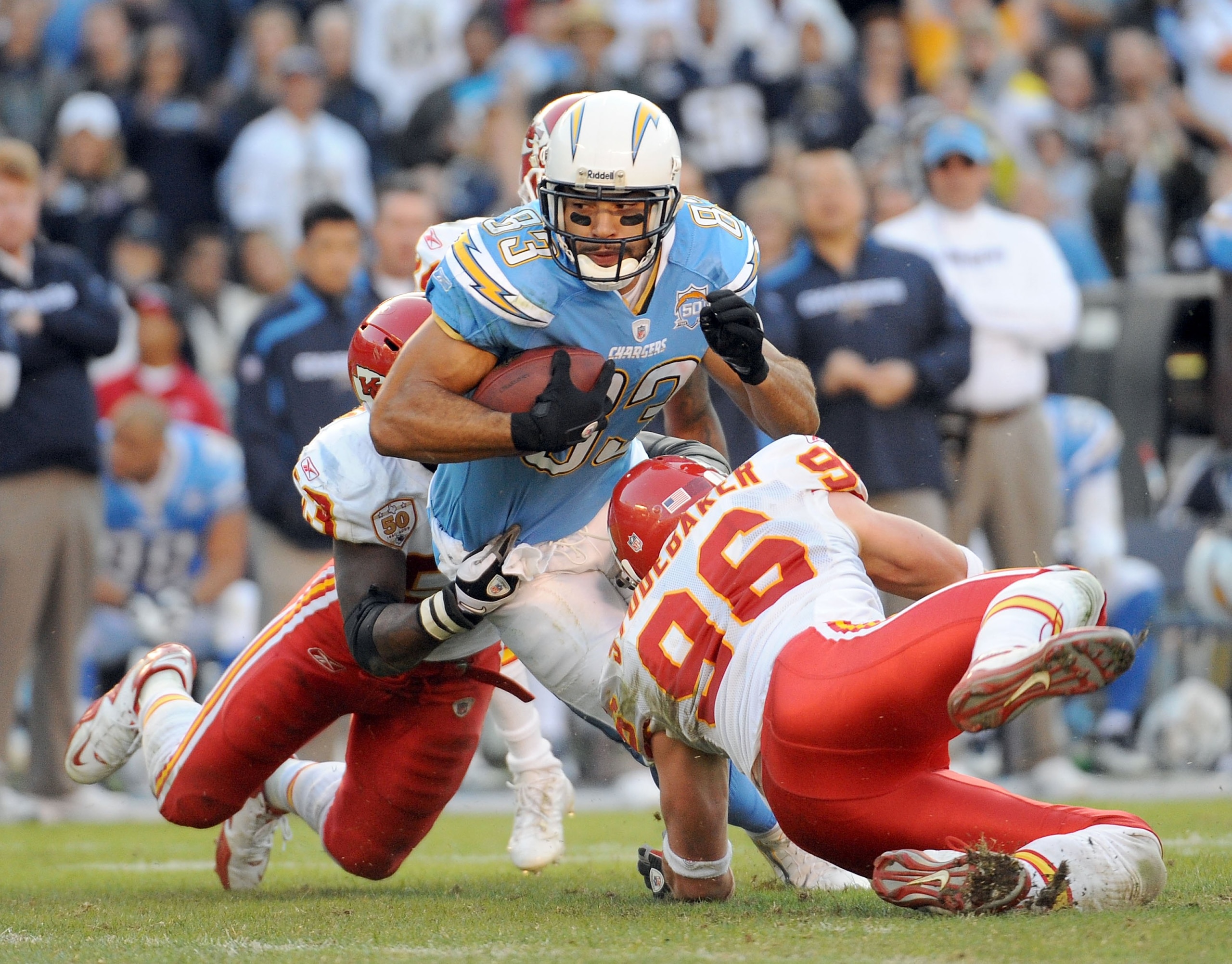 SAN DIEGO - NOVEMBER 29:  Vincent Jackson #83 of the San Diego Chargers is tackled by Demorrio Williams #53 and Brandon Flowers #24 of the Kansas City Chiefs during the game at Qualcomm Stadium on November 29, 2009 in San Diego, California.  (Photo by Har
