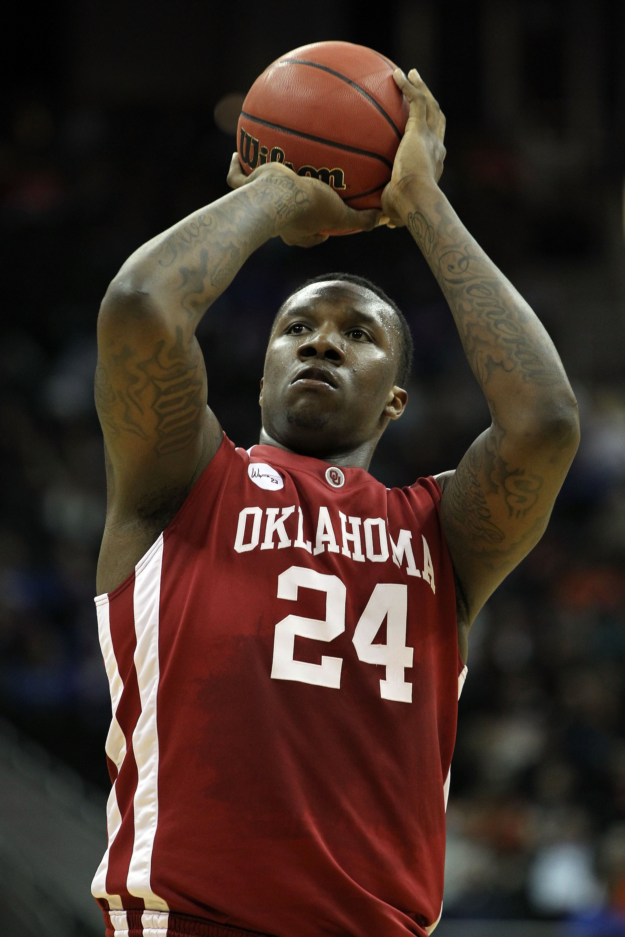 KANSAS CITY, MO - MARCH 10:  Tiny Gallon #24 of the Oklahoma Sooners shoots a free throw against the Oklahoma State Cowboys during the first round game of the 2010 Phillips 66 Big 12 Men's Basketball Tournament at the Sprint Center on March 10, 2010 in Ka