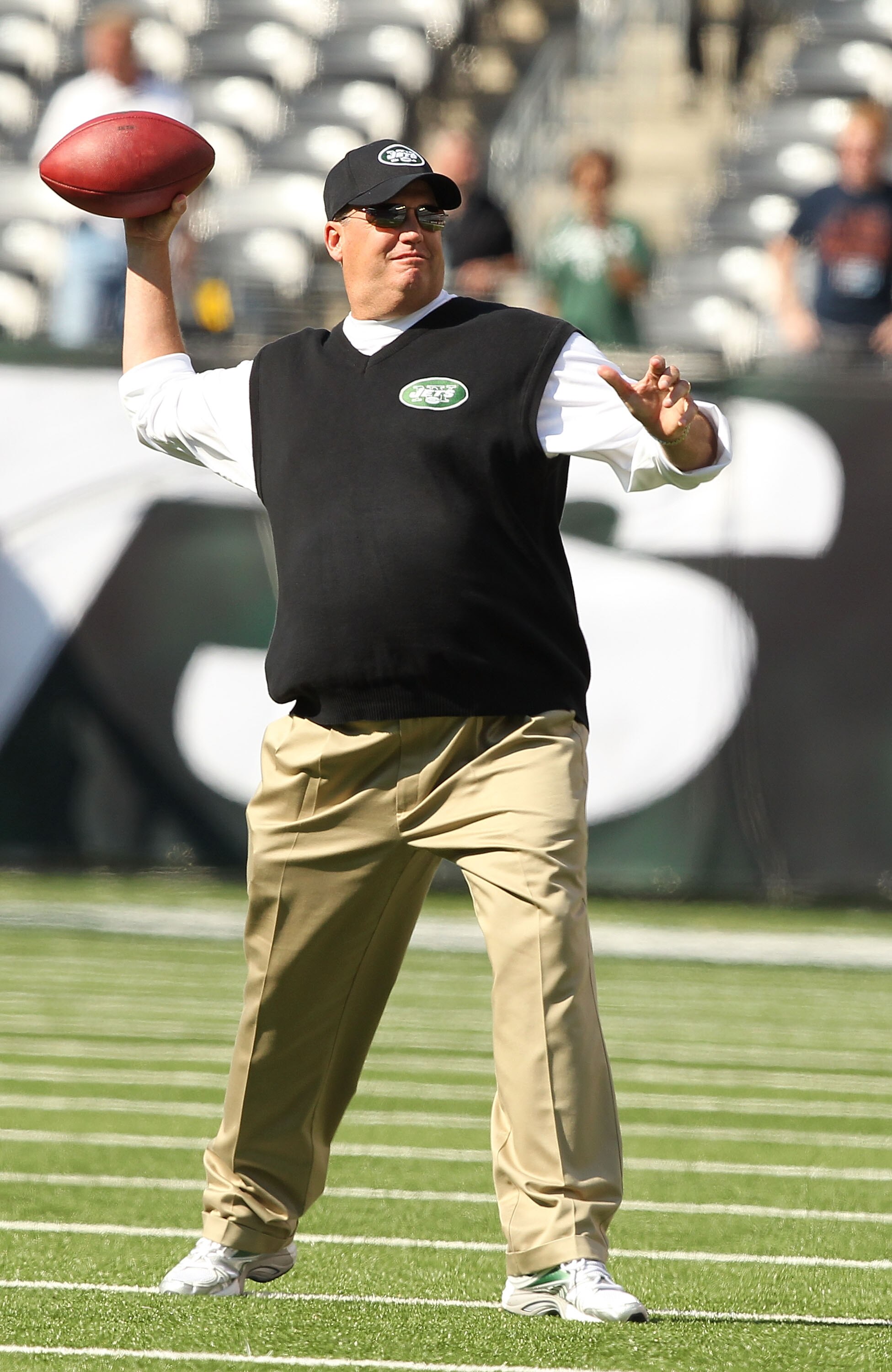 EAST RUTHERFORD, NJ - SEPTEMBER 19:  Rex Ryan, Head Coach of the New York Jets throws passes before the game against the New England Patriots on September 19, 2010 at the New Meadowlands Stadium  in East Rutherford, New Jersey.  (Photo by Al Bello/Getty I