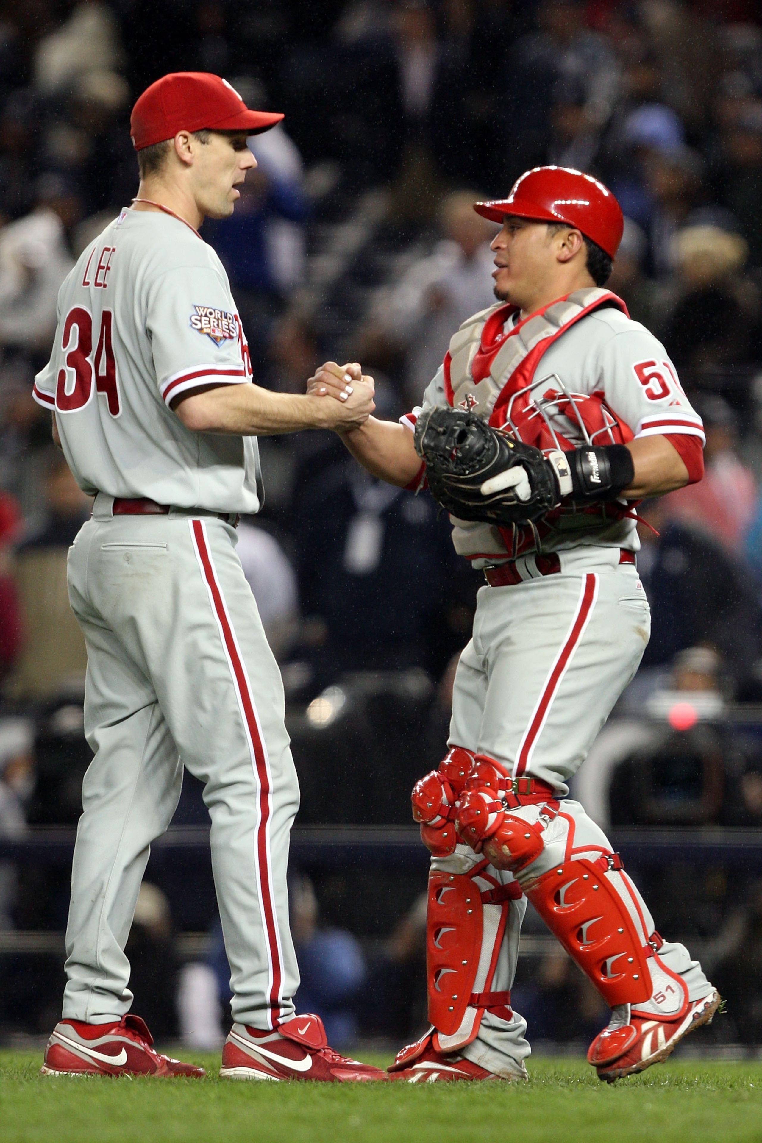 NEW YORK - OCTOBER 28:  (L-R) Cliff Lee #34 and Carlos Ruiz #51 of the Philadelphia Phillies celebrate after their 6-1 win against the New York Yankees in Game One of the 2009 MLB World Series at Yankee Stadium on October 28, 2009 in the Bronx borough of